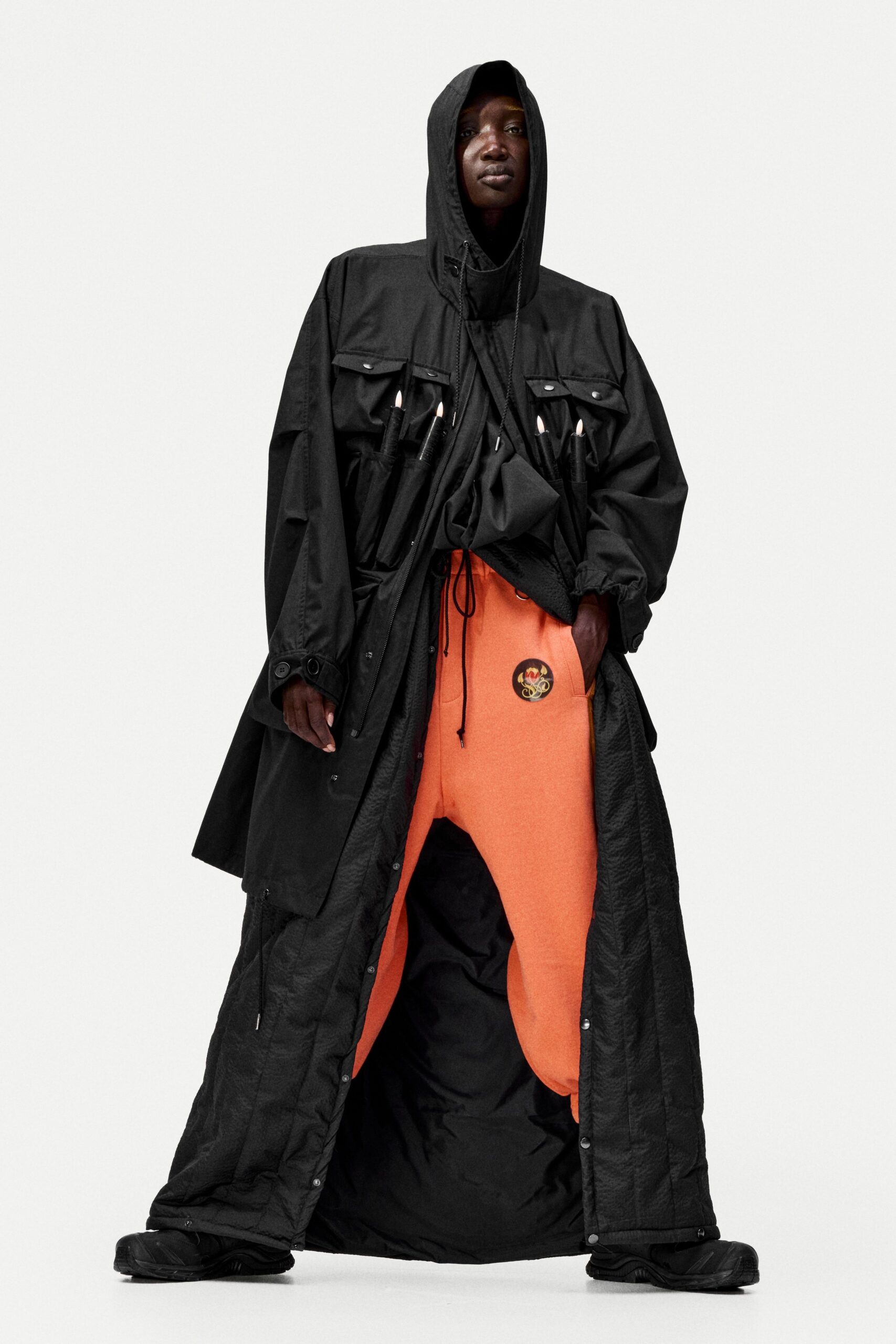 black coat orange pants outfit