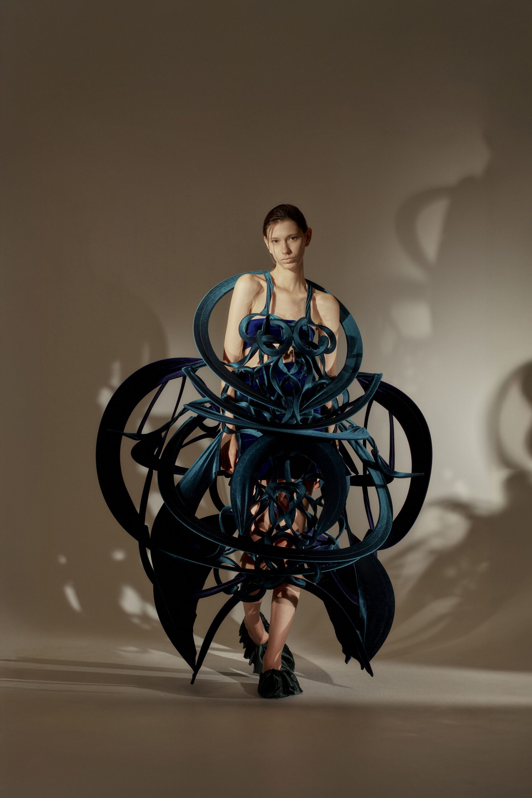 blue sculptural sleeveless dress