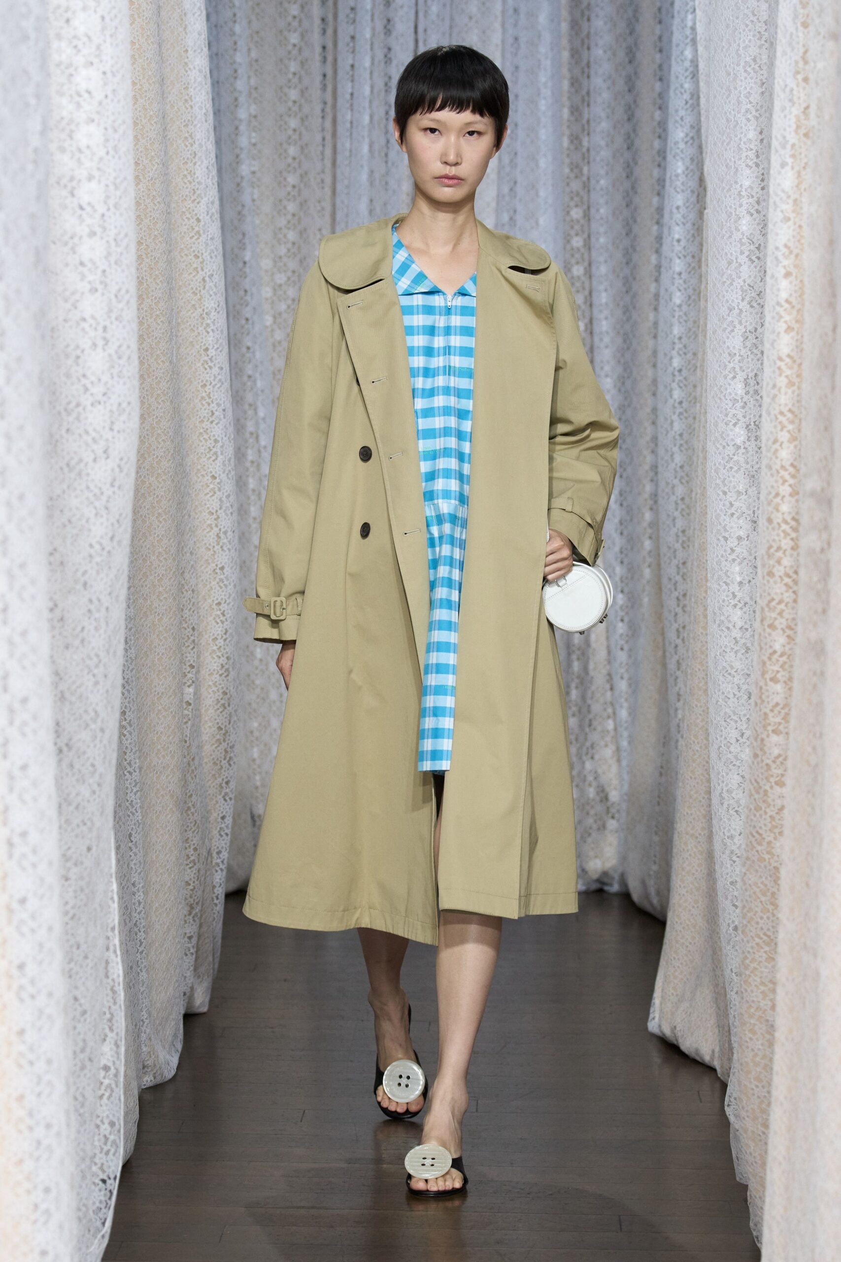 beige trench coat and blue checked dress