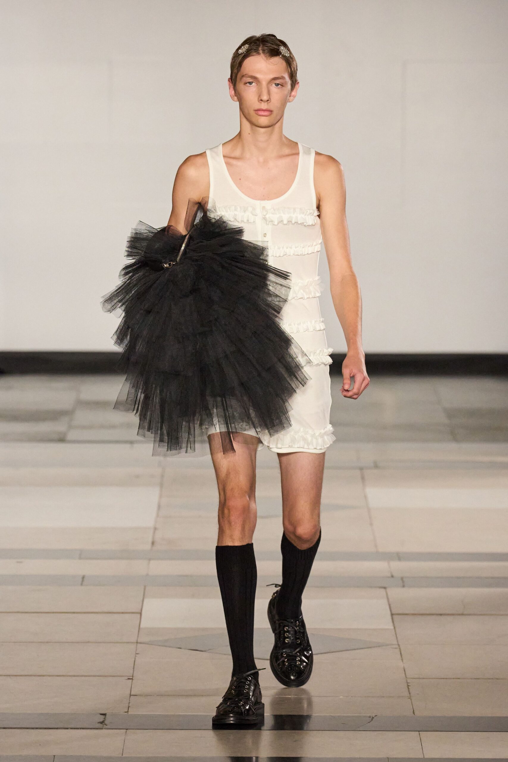 white fitted mini dress with black tulle skirt