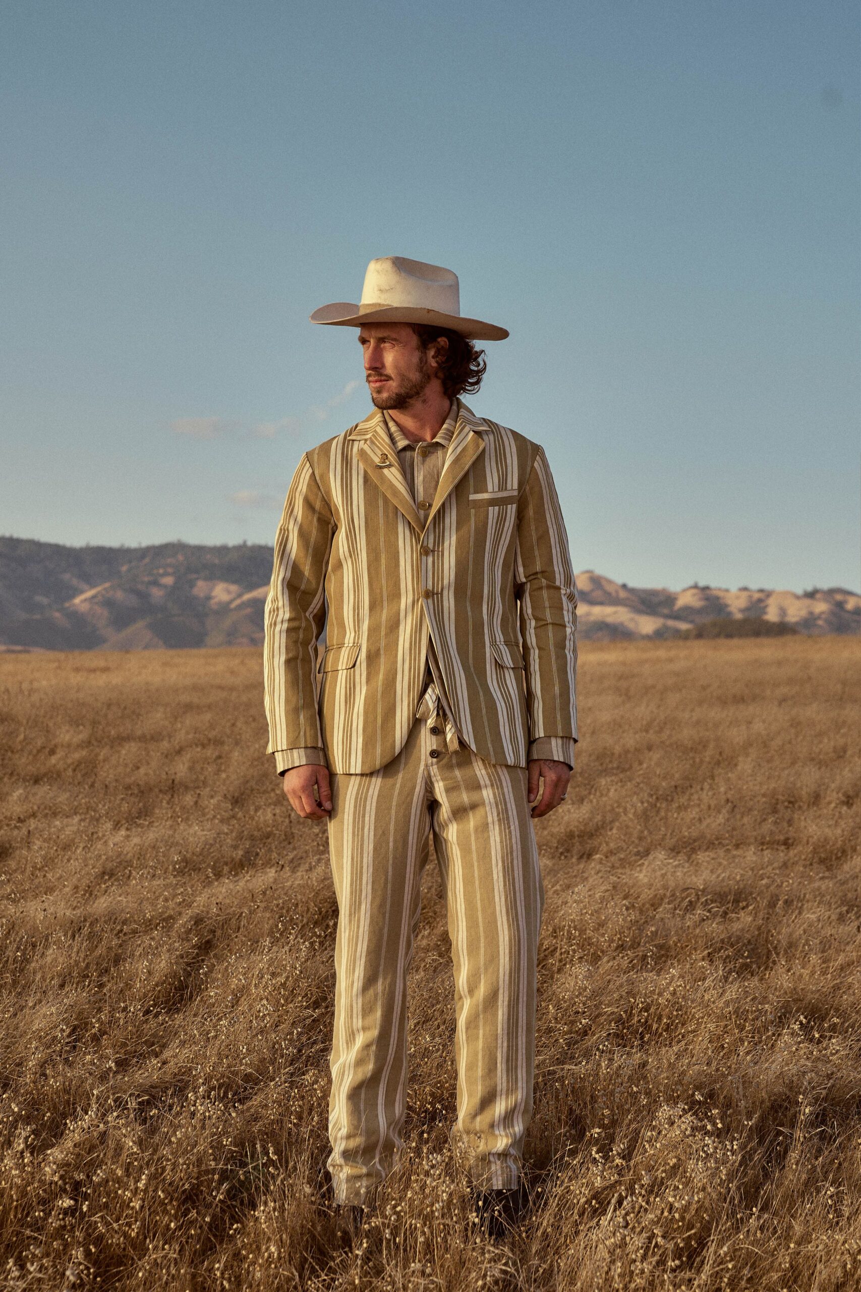 beige striped suit with hat