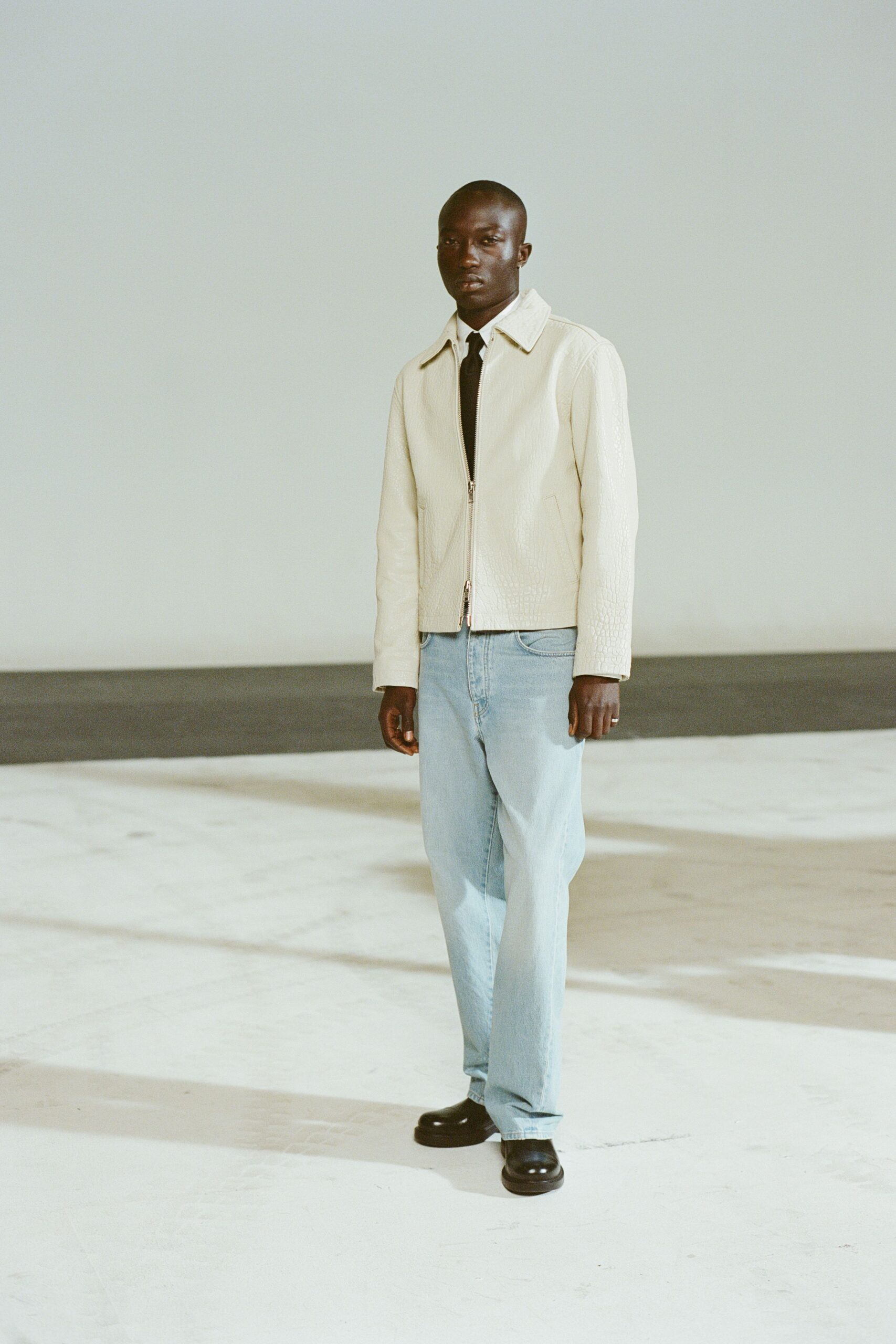 white leather long-sleeve collared fitted zippered jacket
