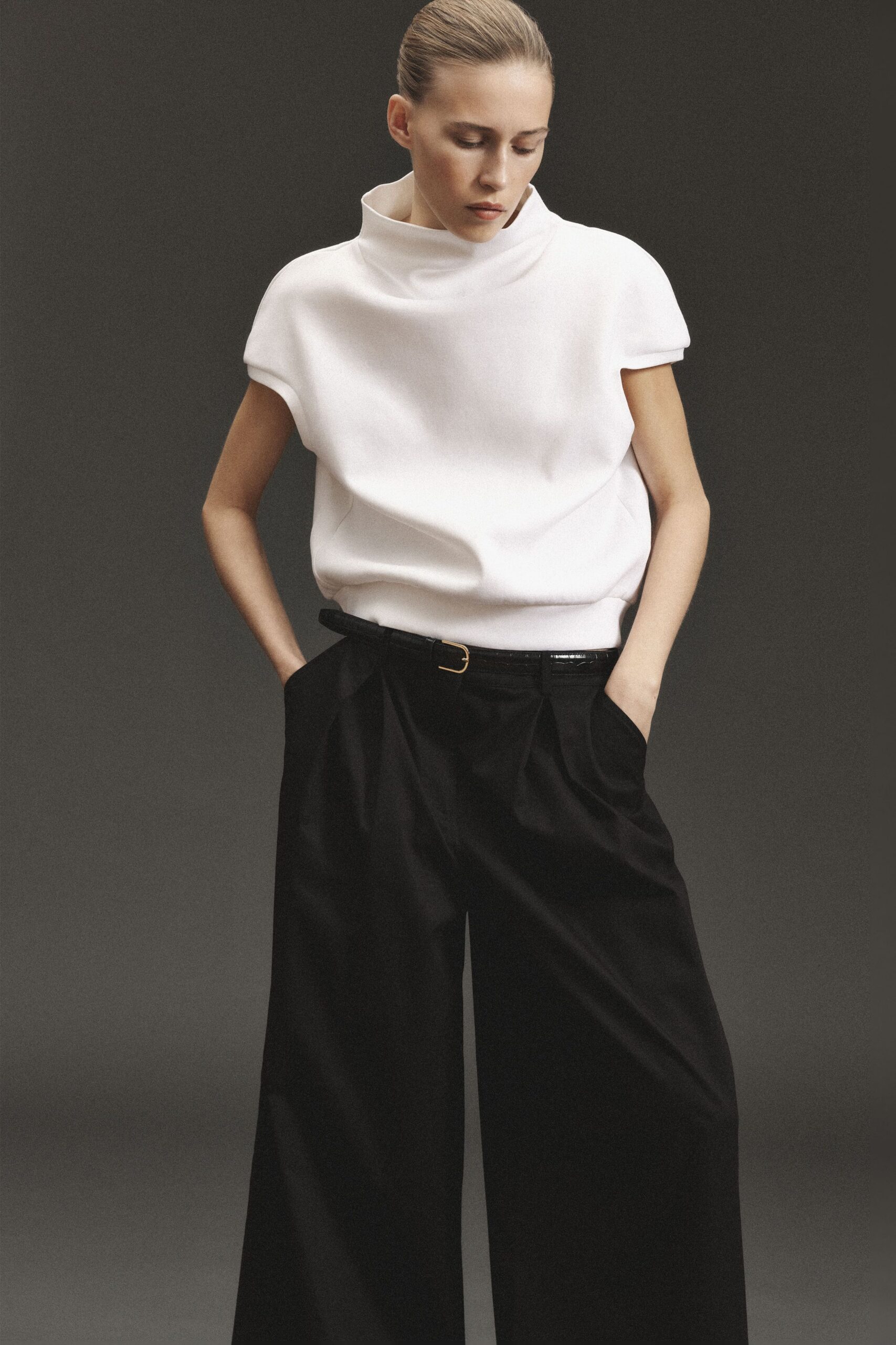 white relaxed top with black pants