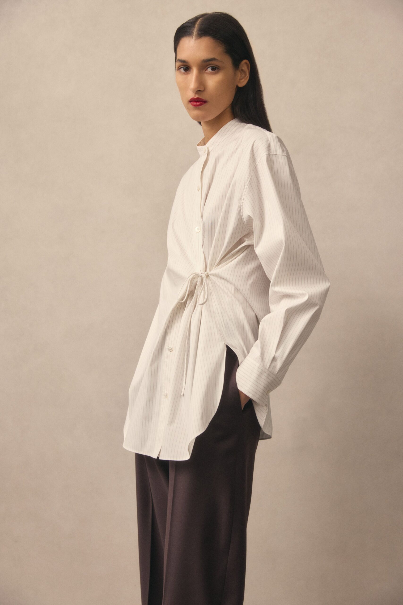 white relaxed shirt with brown pants