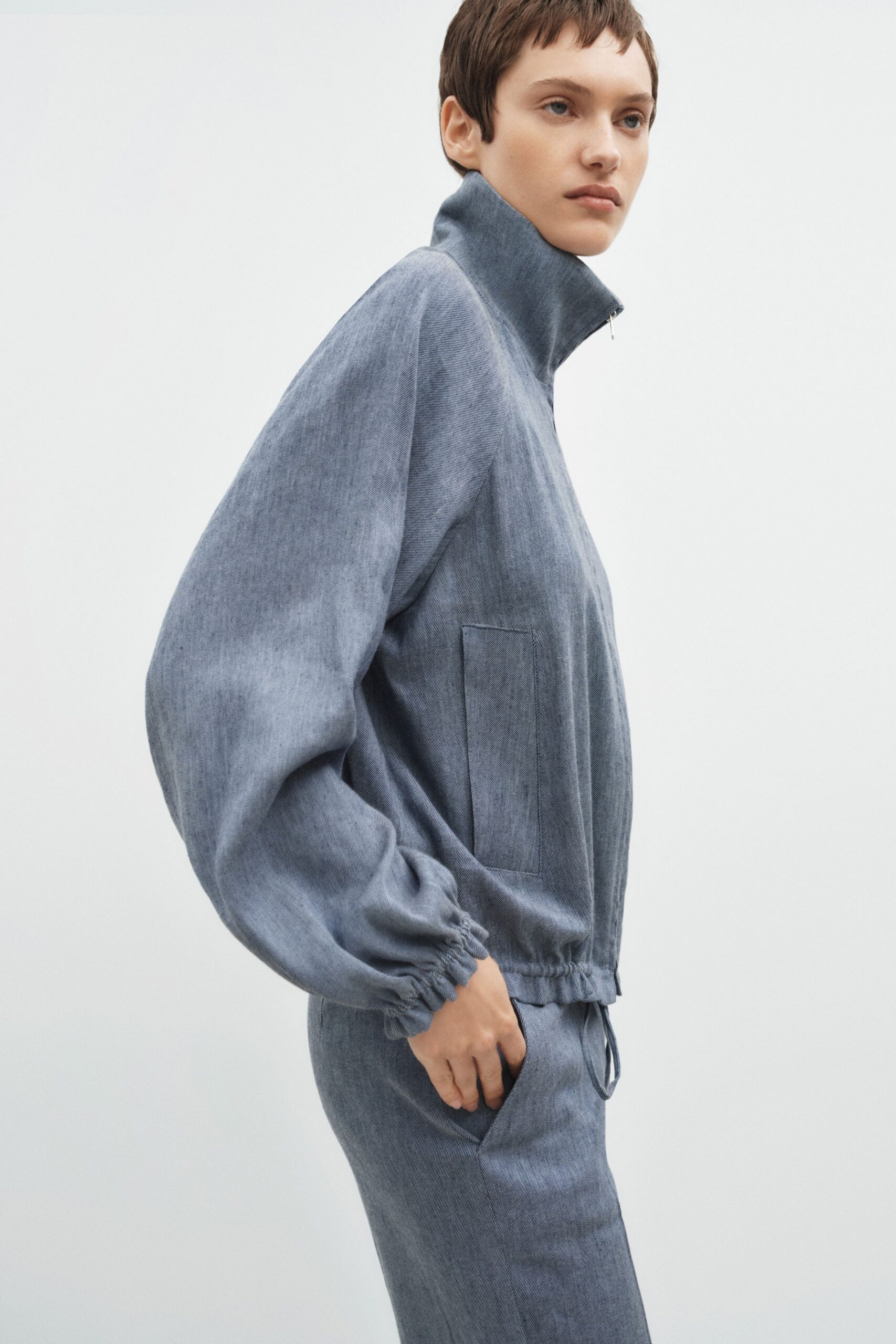 blue denim long-sleeve collared relaxed zippered pockets jacket