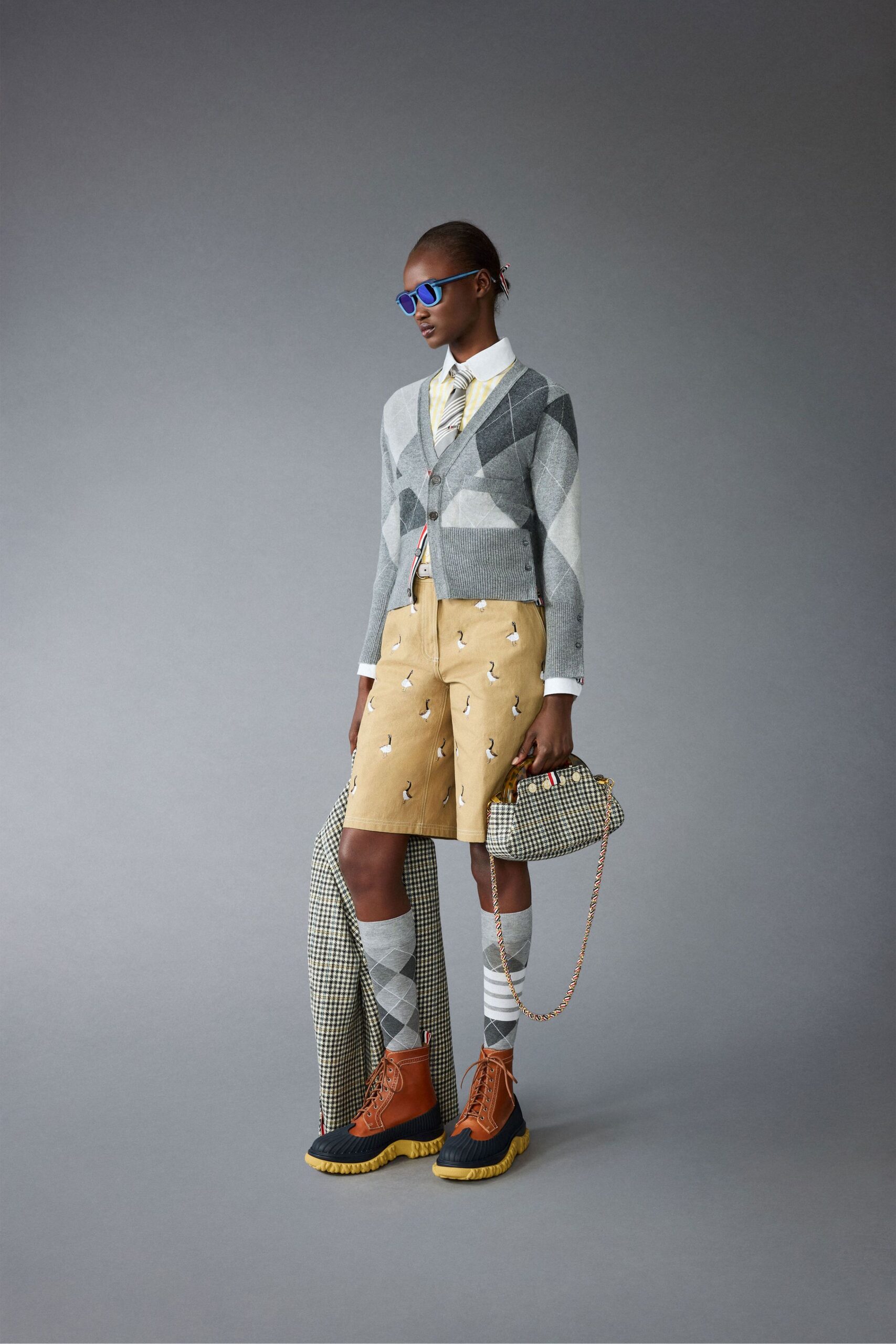 gray blazer with yellow shorts