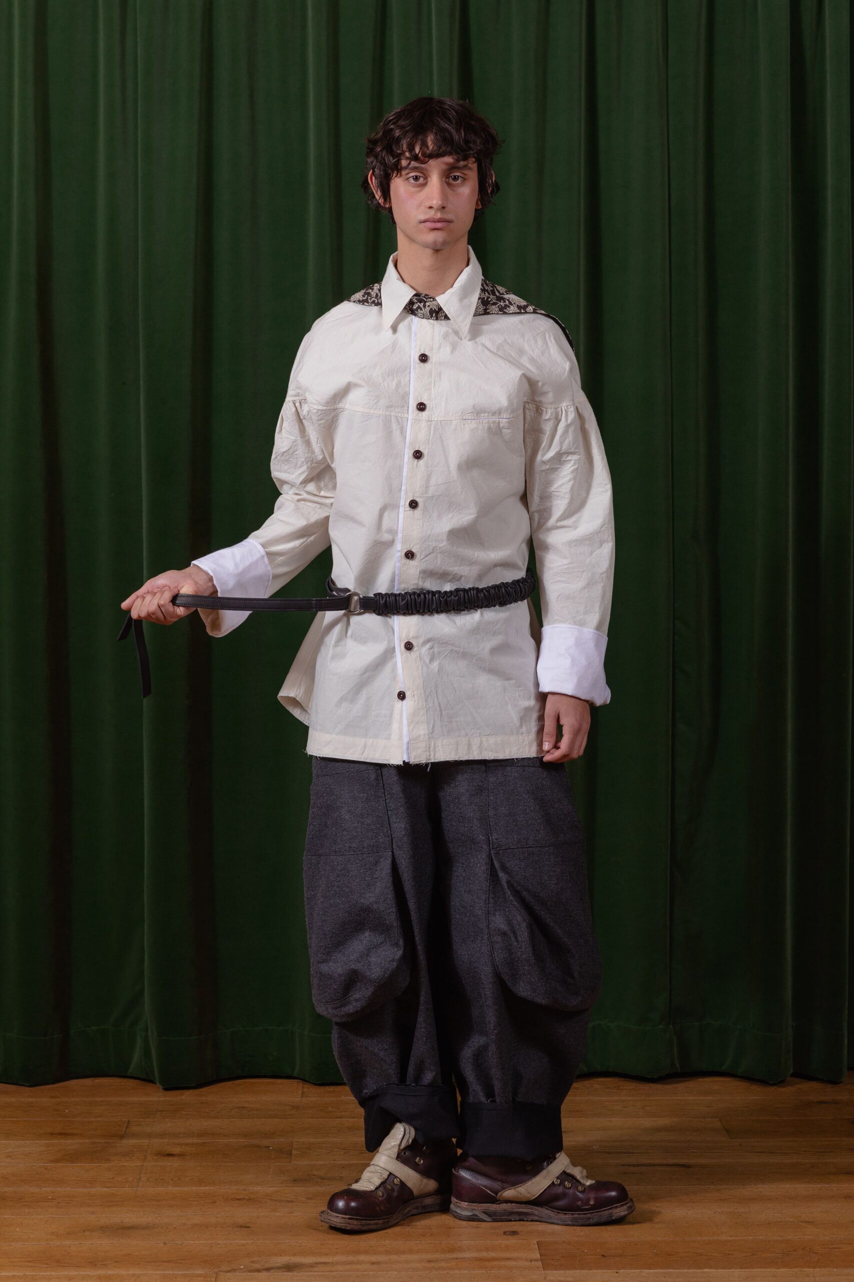 white relaxed shirt gray pants