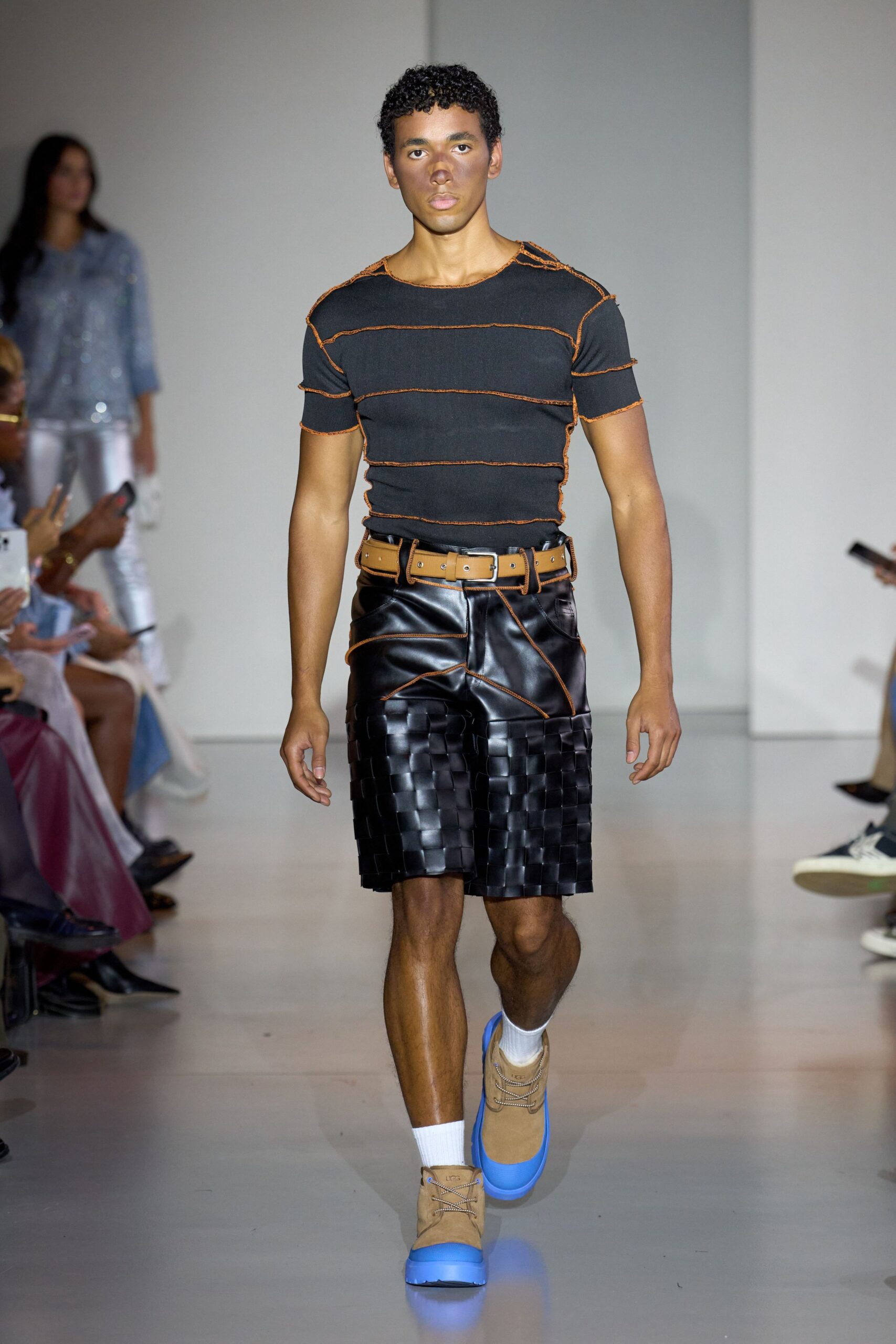 black and orange fitted t-shirt with leather shorts