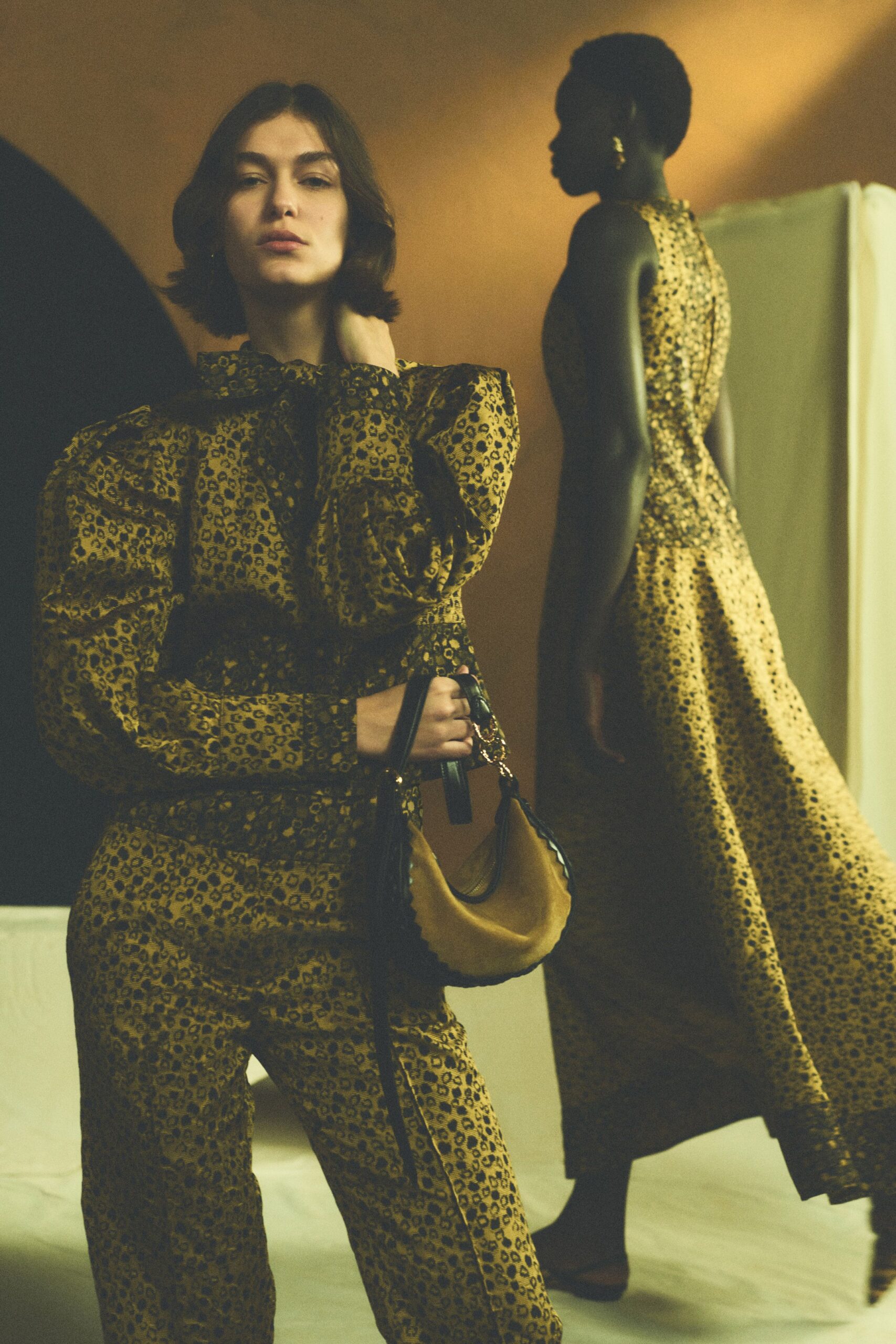 yellow silk sleeveless high-neck fitted animal-print flowing gown