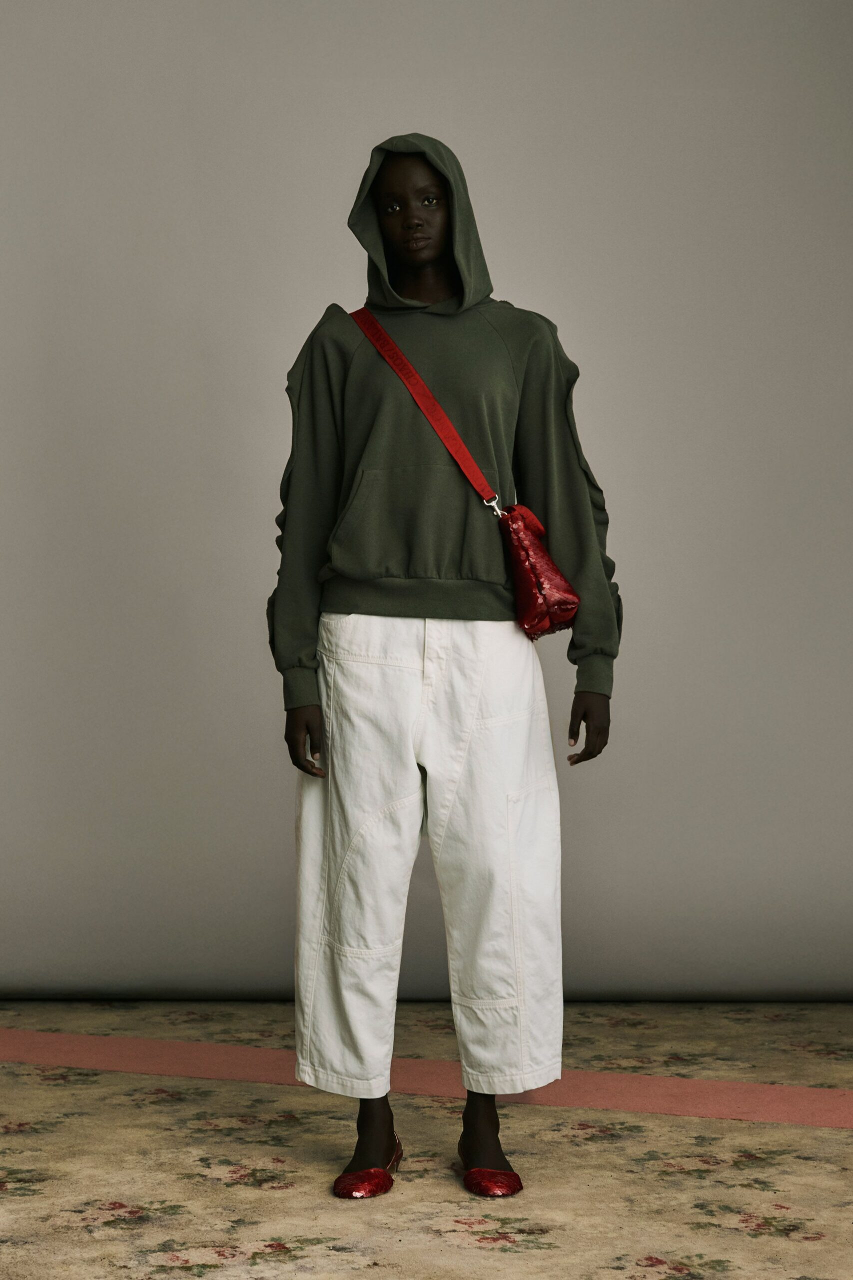 green relaxed hoodie with white pants