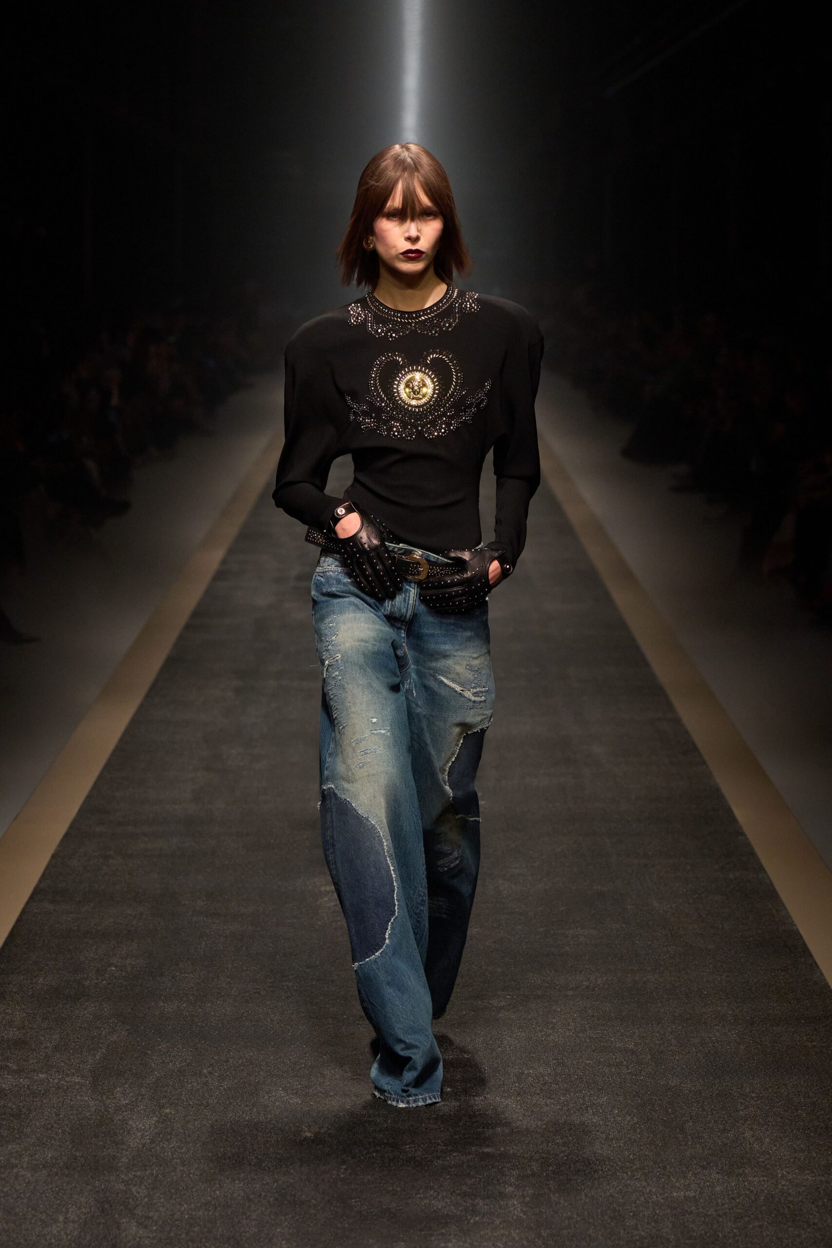 black fitted top and distressed jeans