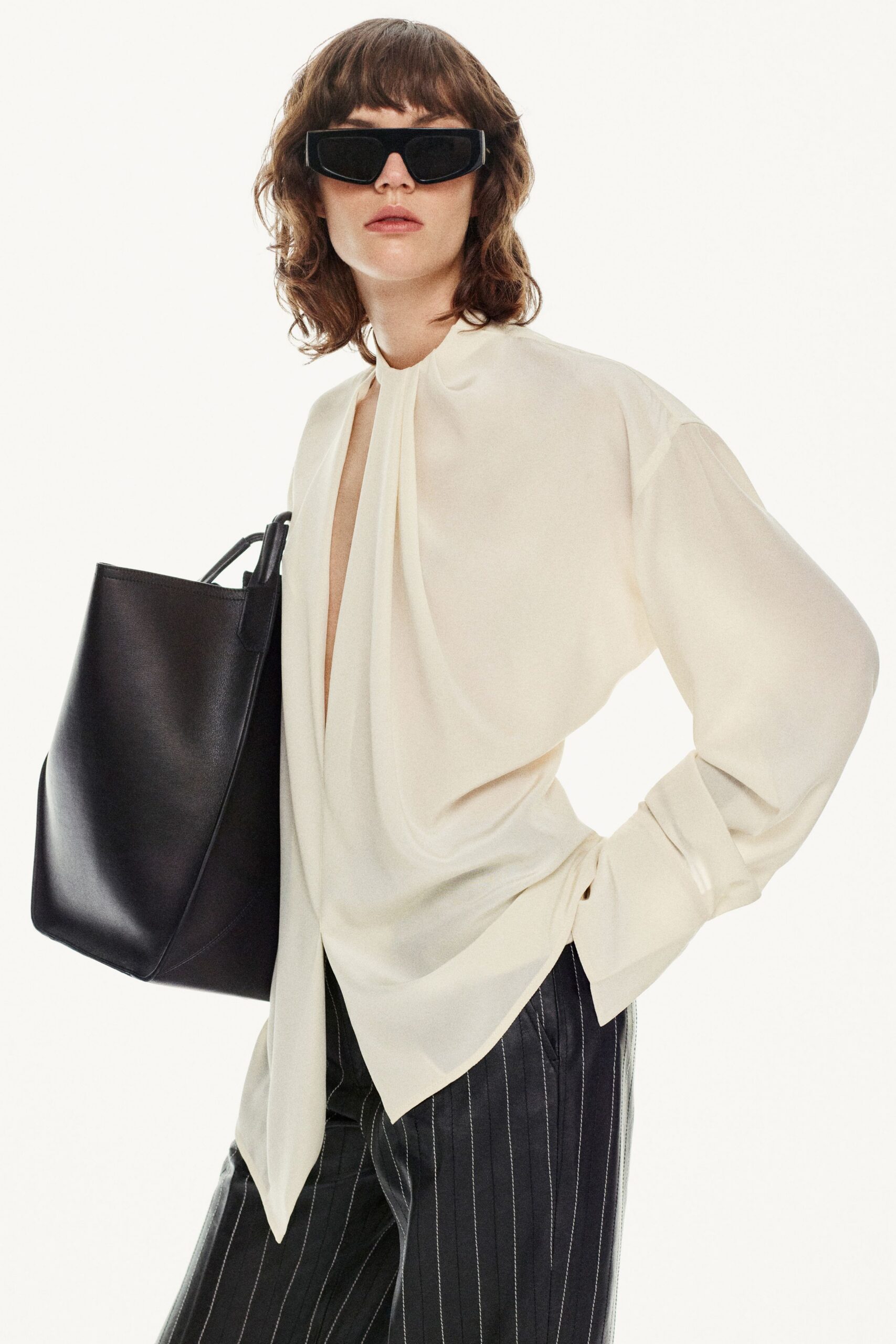 white silk relaxed blouse with striped pants