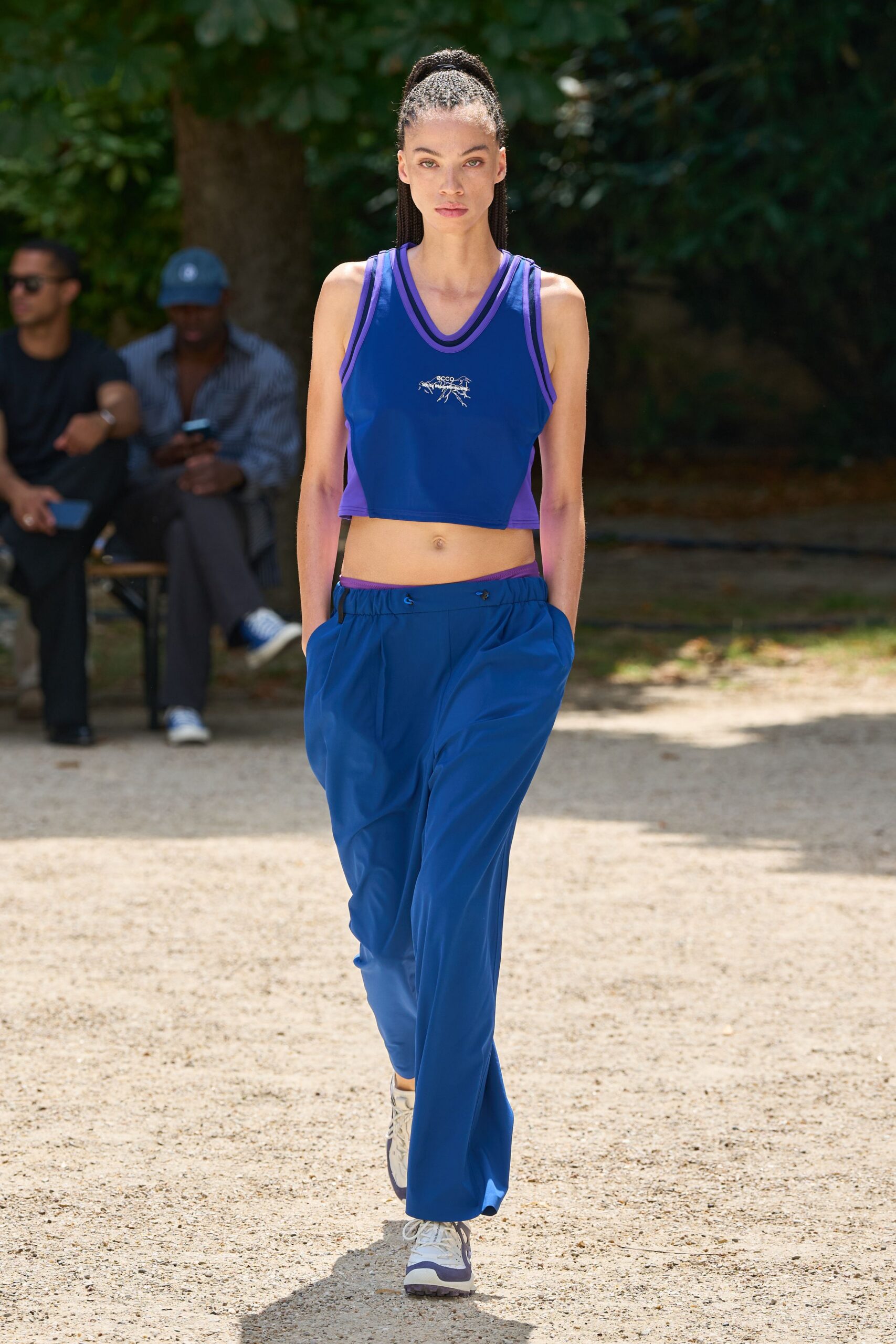 purple crop-top blue pants