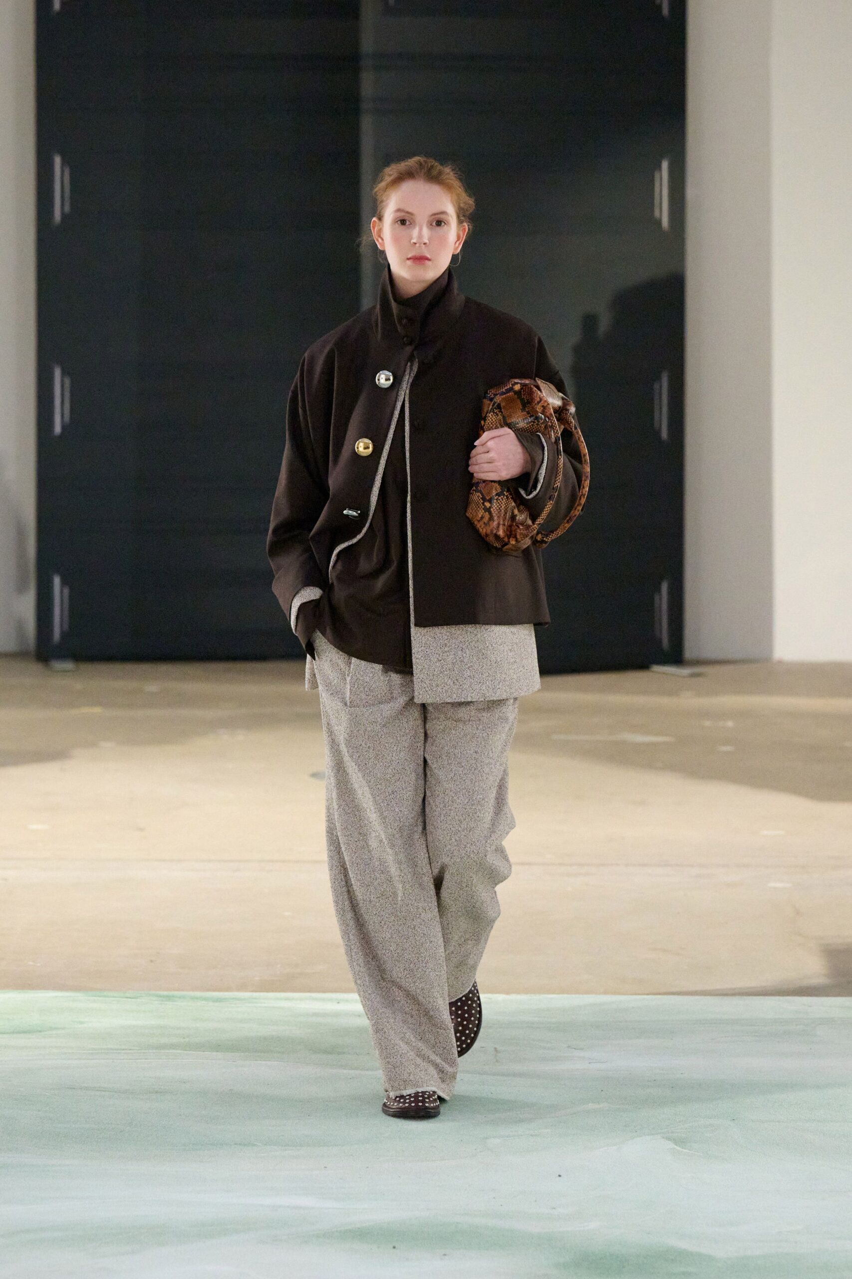black wool long-sleeve collared oversized buttoned jacket