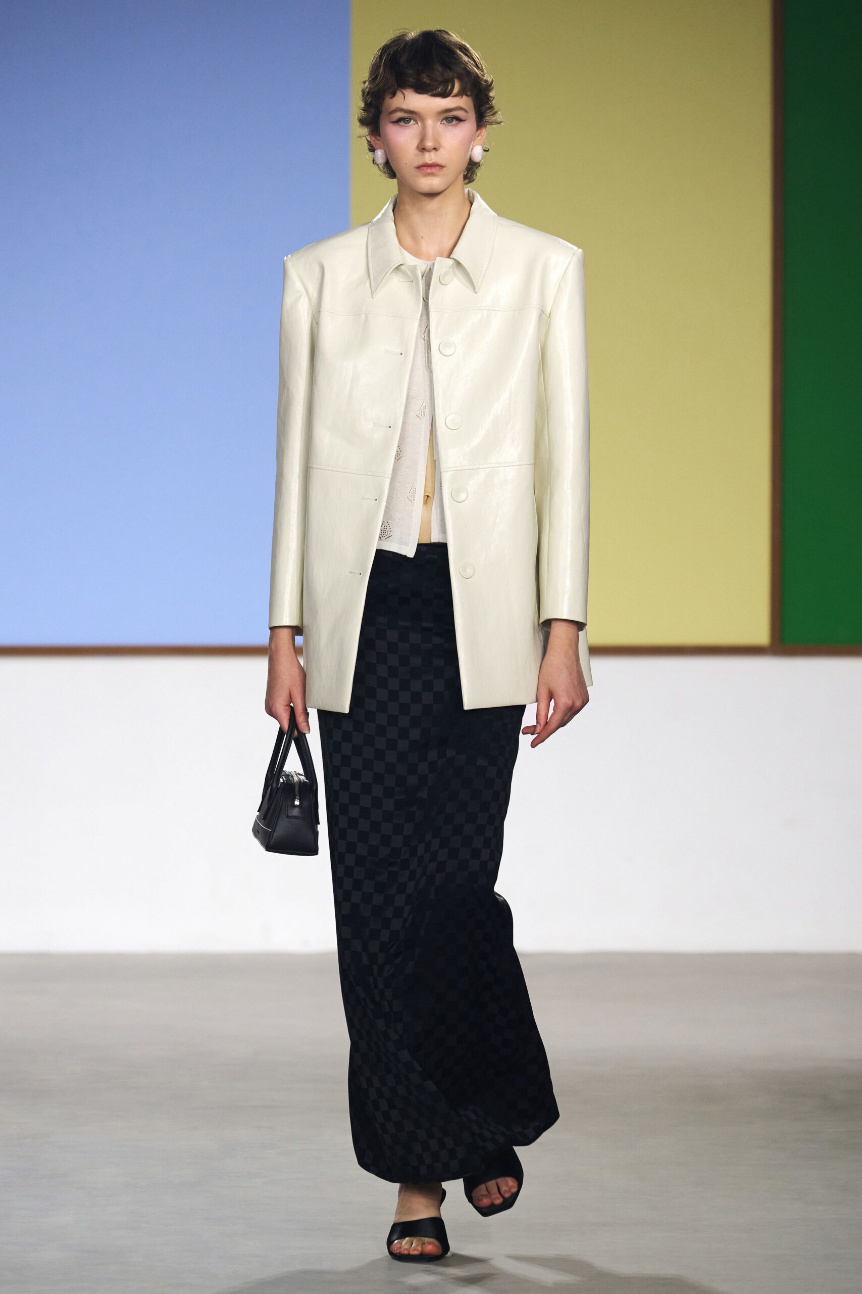 white leather blazer with black skirt