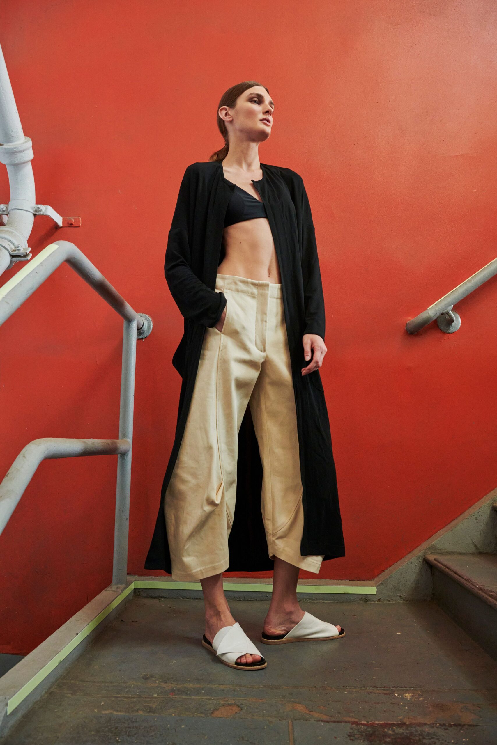 black coat with beige pants