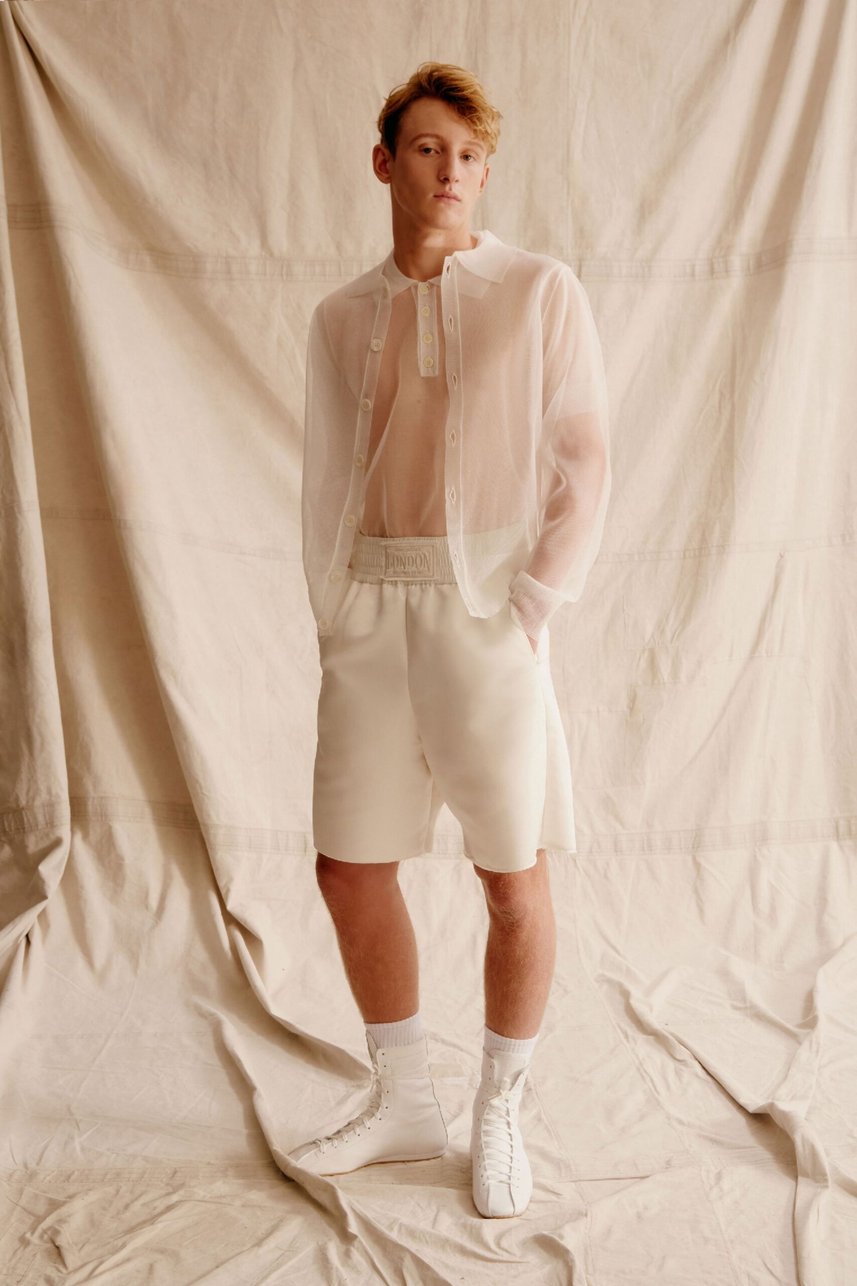 white cotton long-sleeve collared relaxed sheer shirt