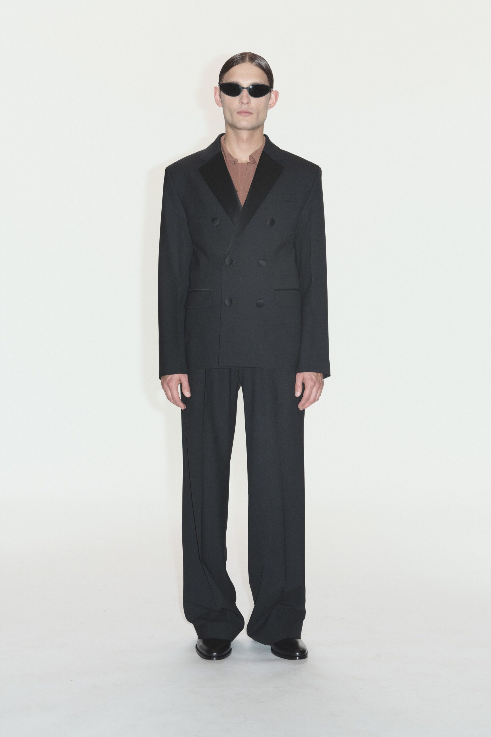 black tailored suit with brown shirt