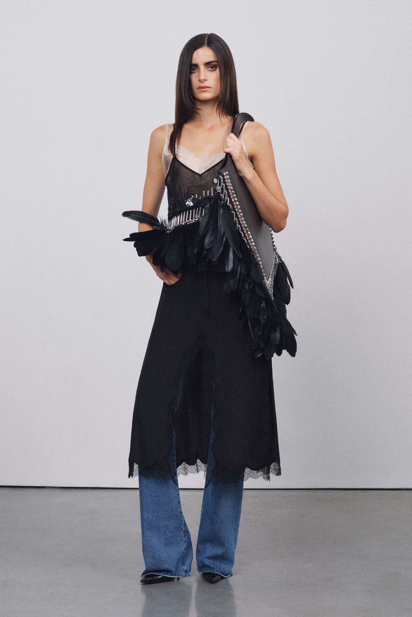 black midi dress with fringed bag