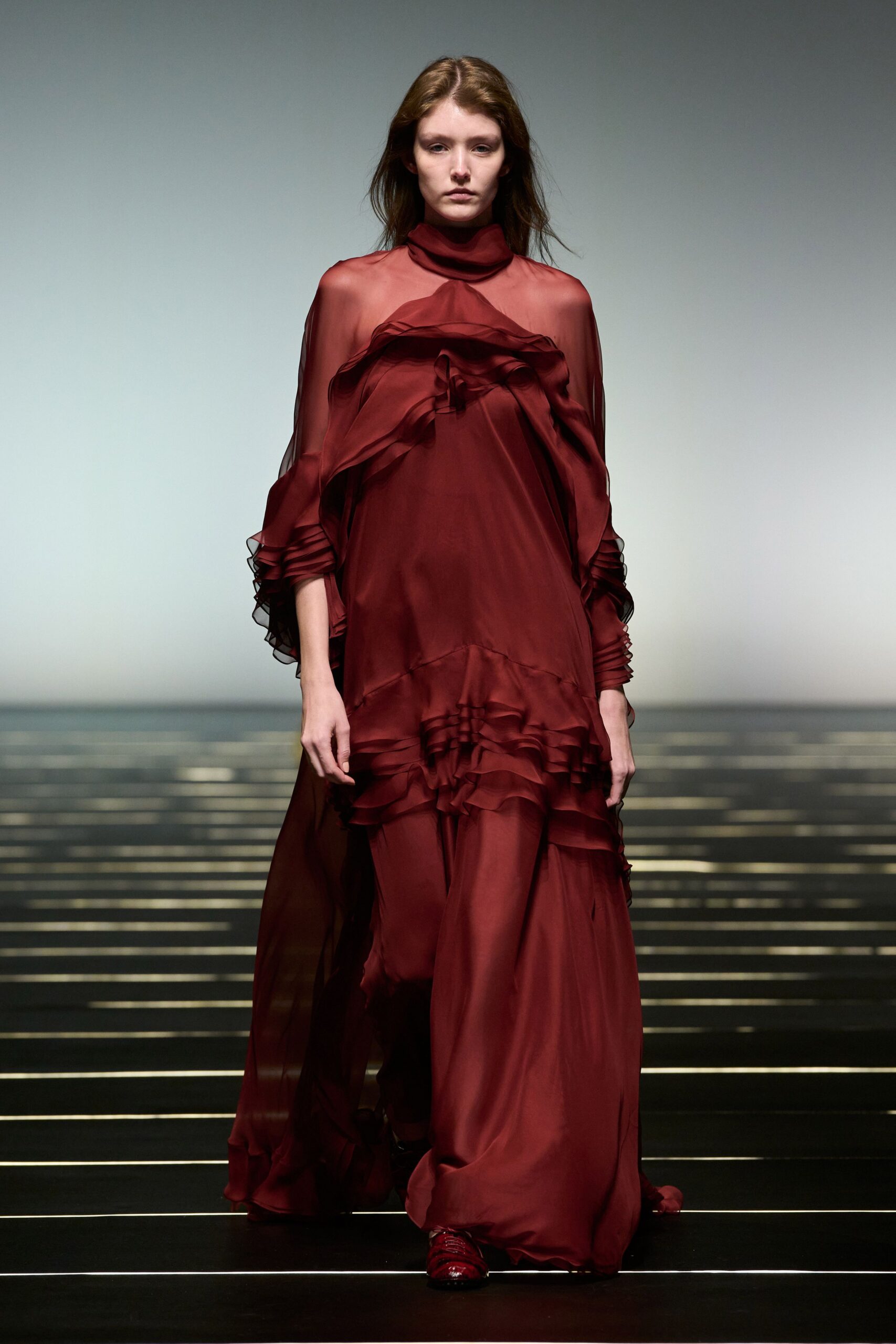 red flowing ruffled gown