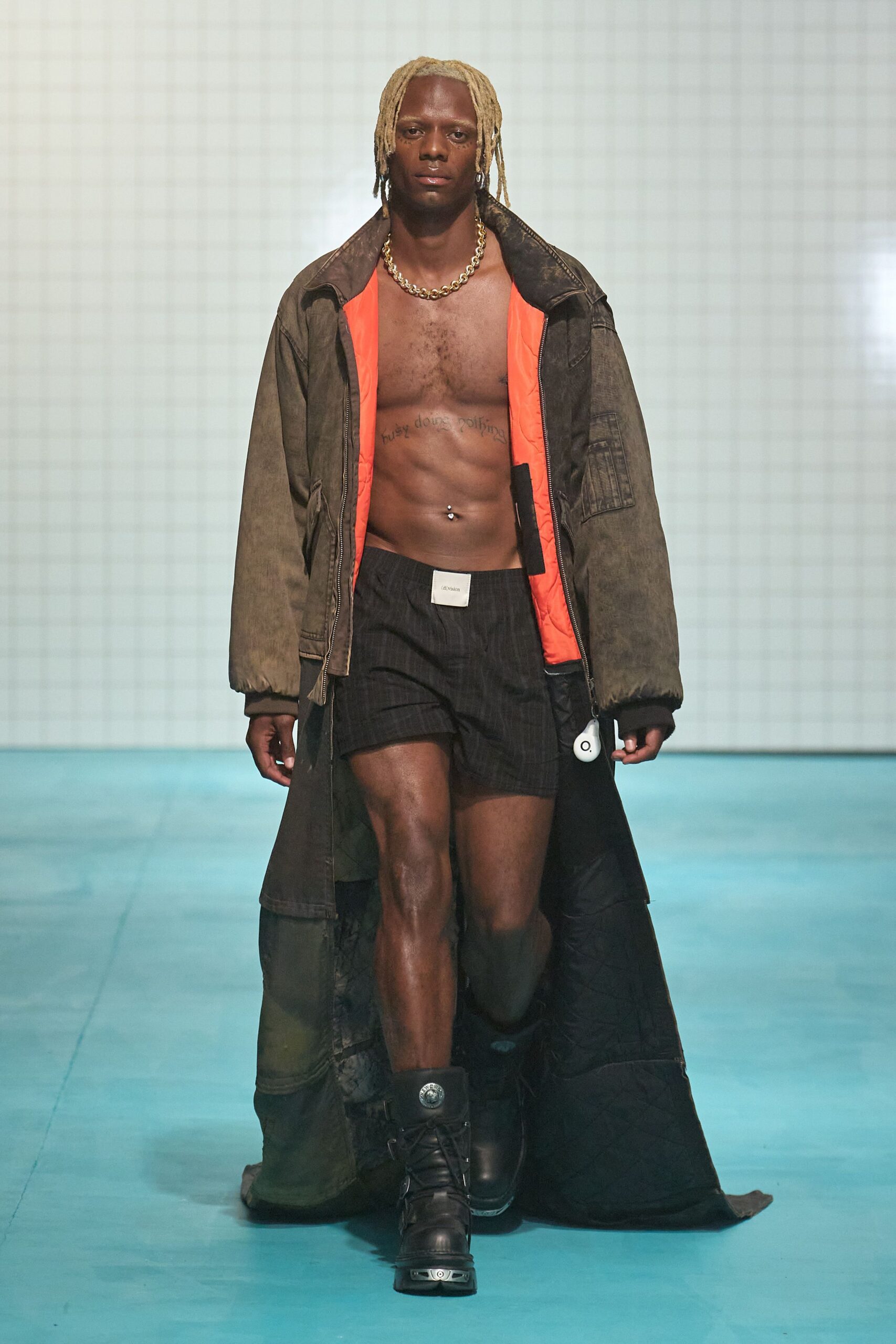 brown relaxed coat with black shorts
