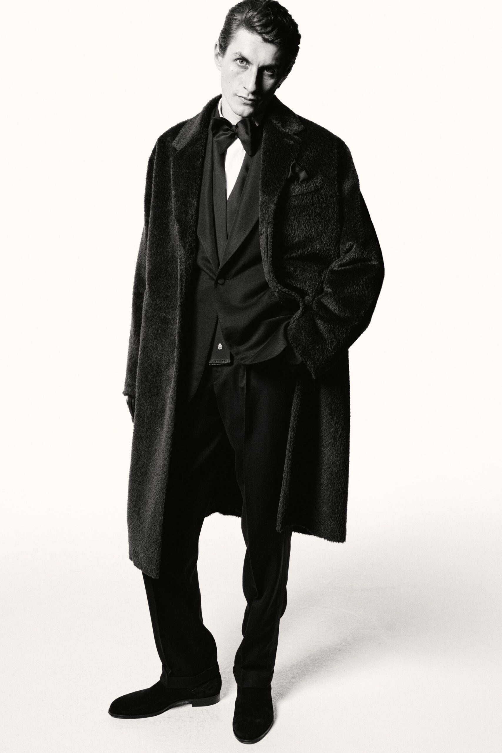 black fur coat and tailored suit