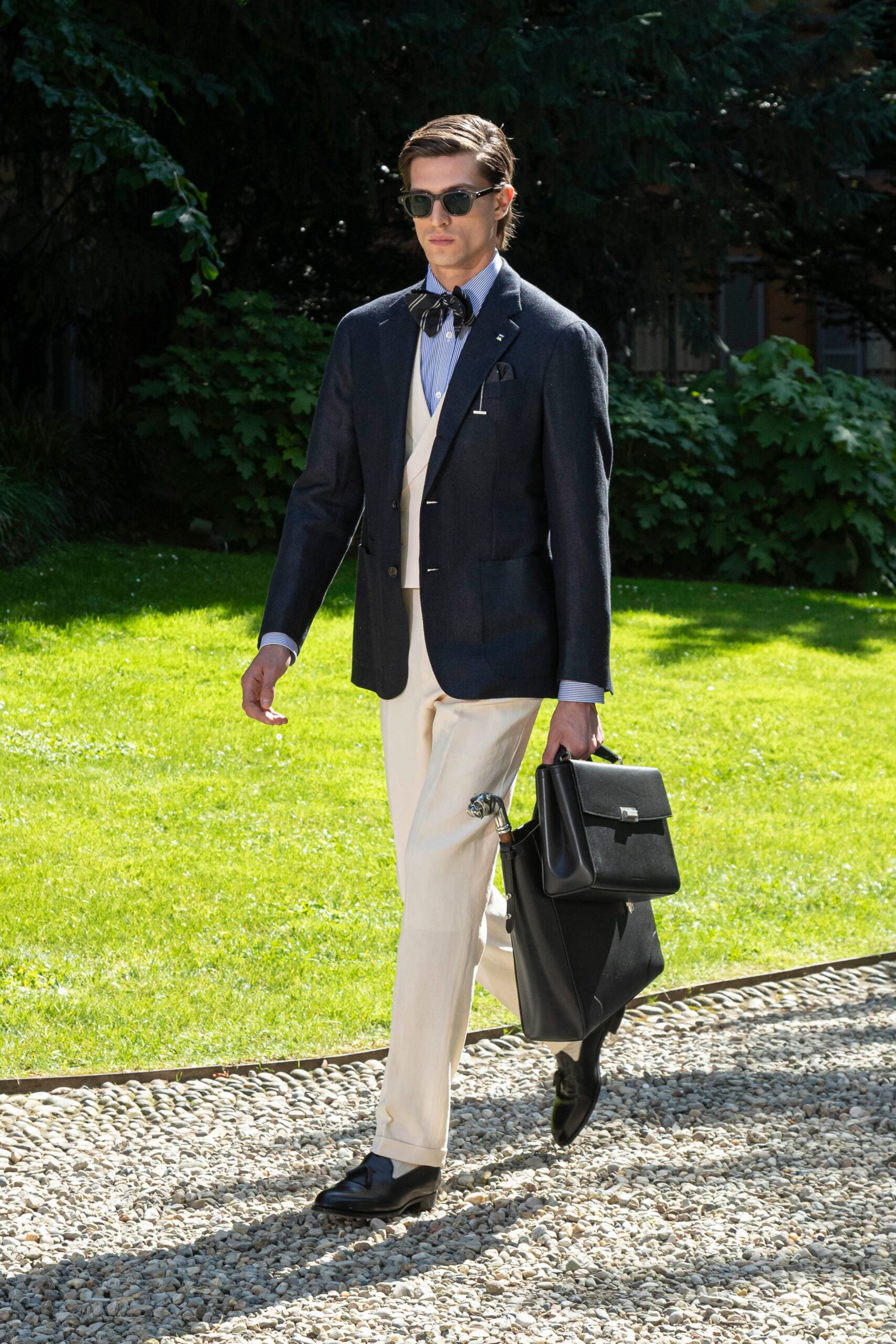 black tailored suit with beige pants