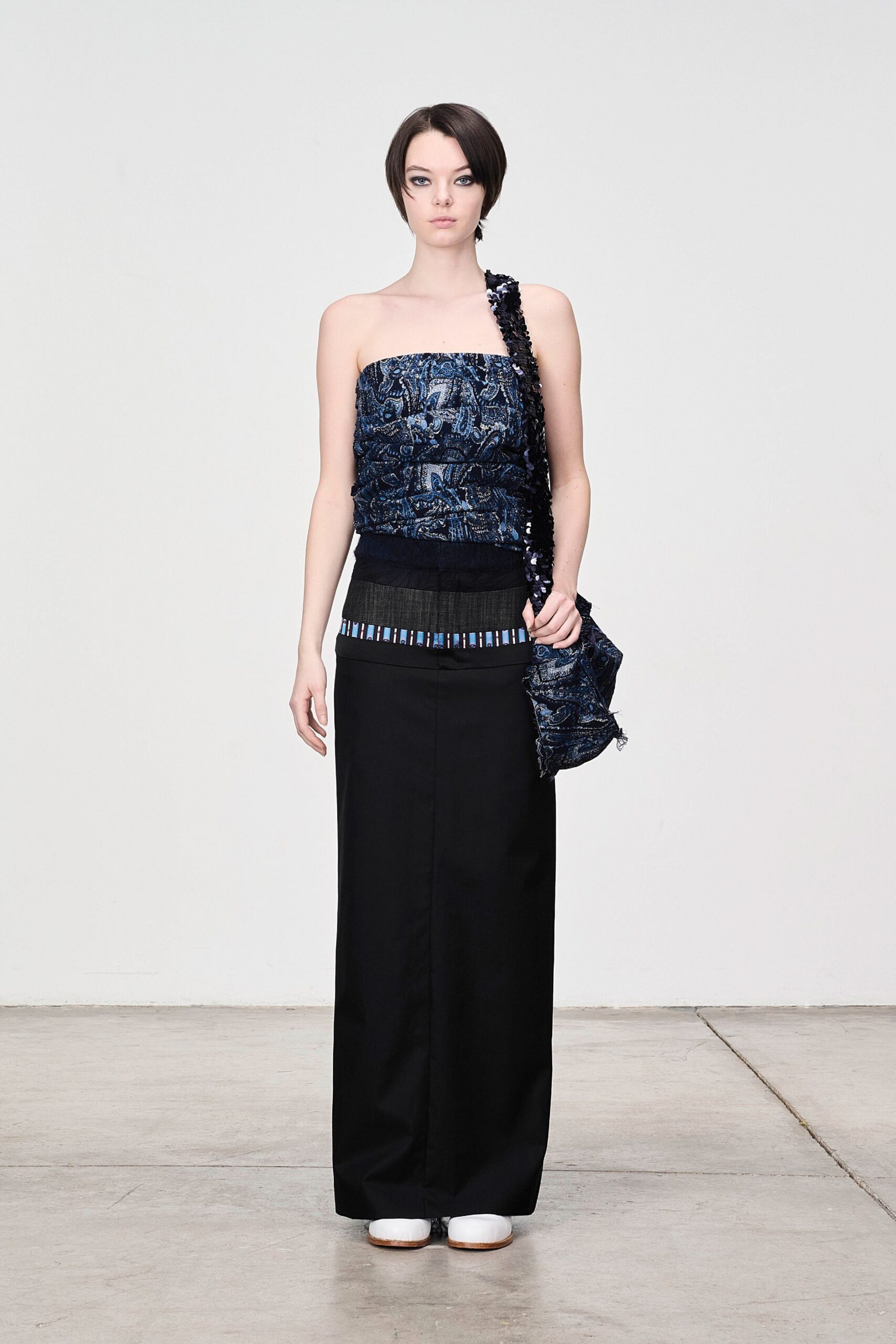 blue embellished top with black skirt