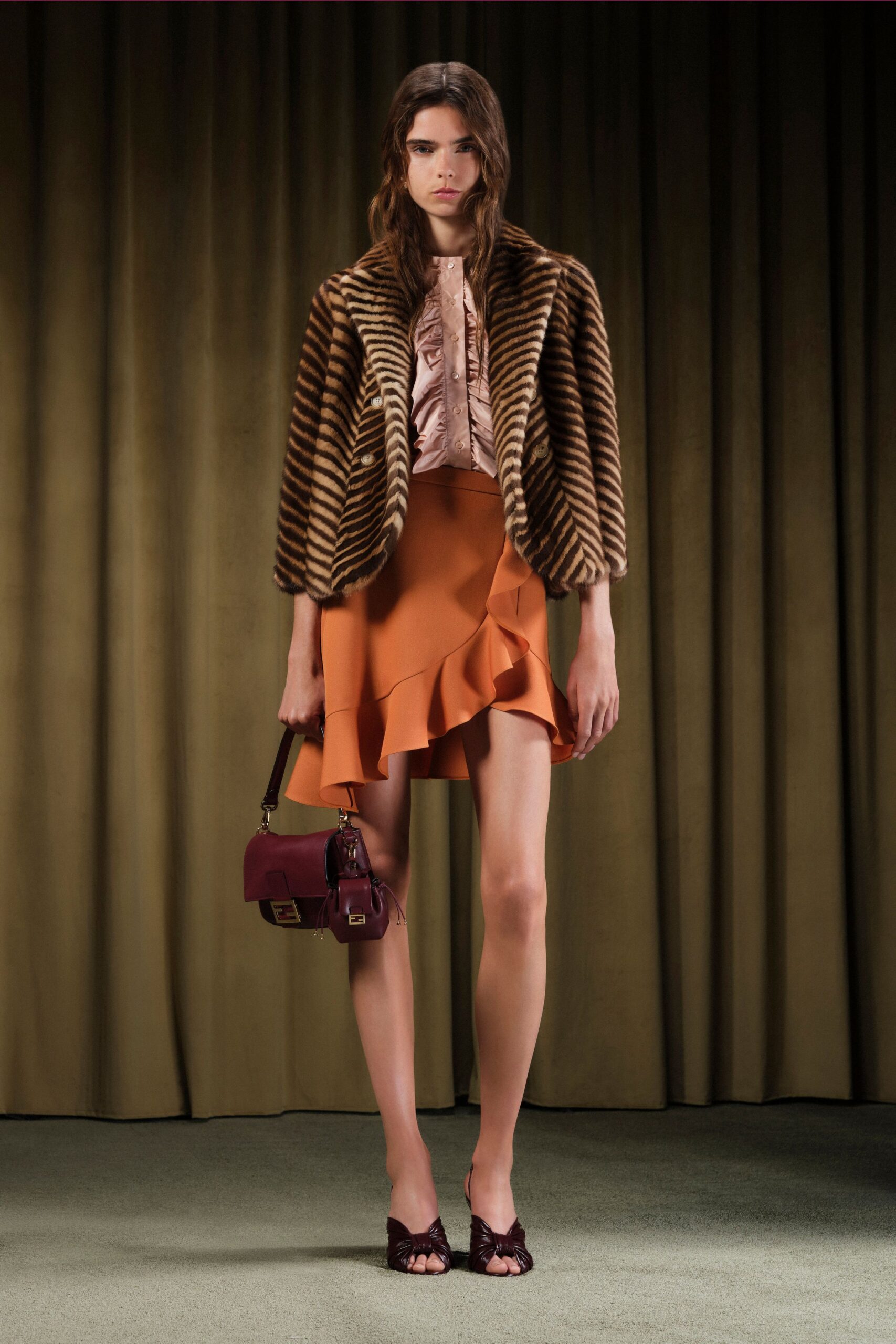 brown striped fur jacket with pink blouse