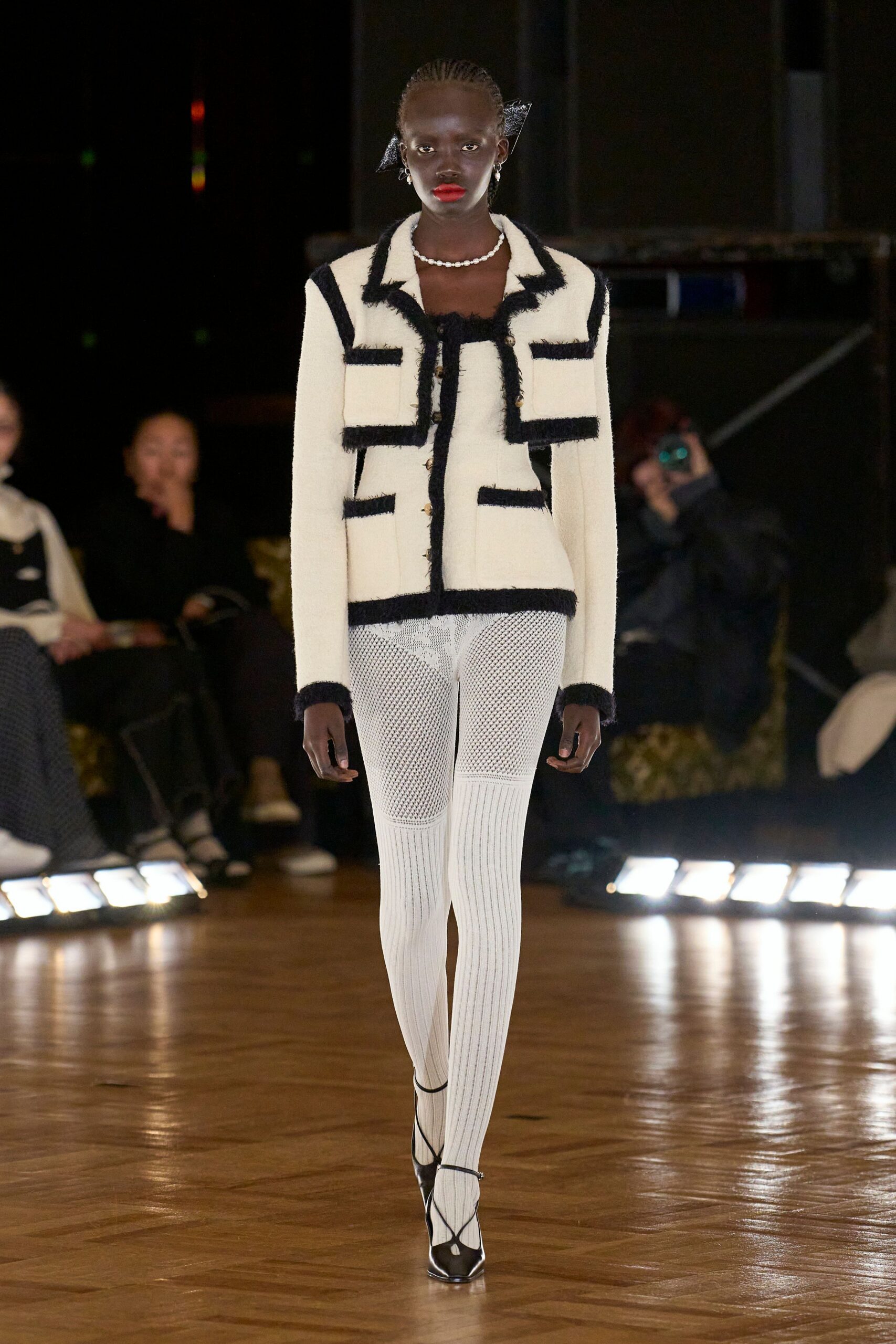 black and white fitted jacket with ribbed pants