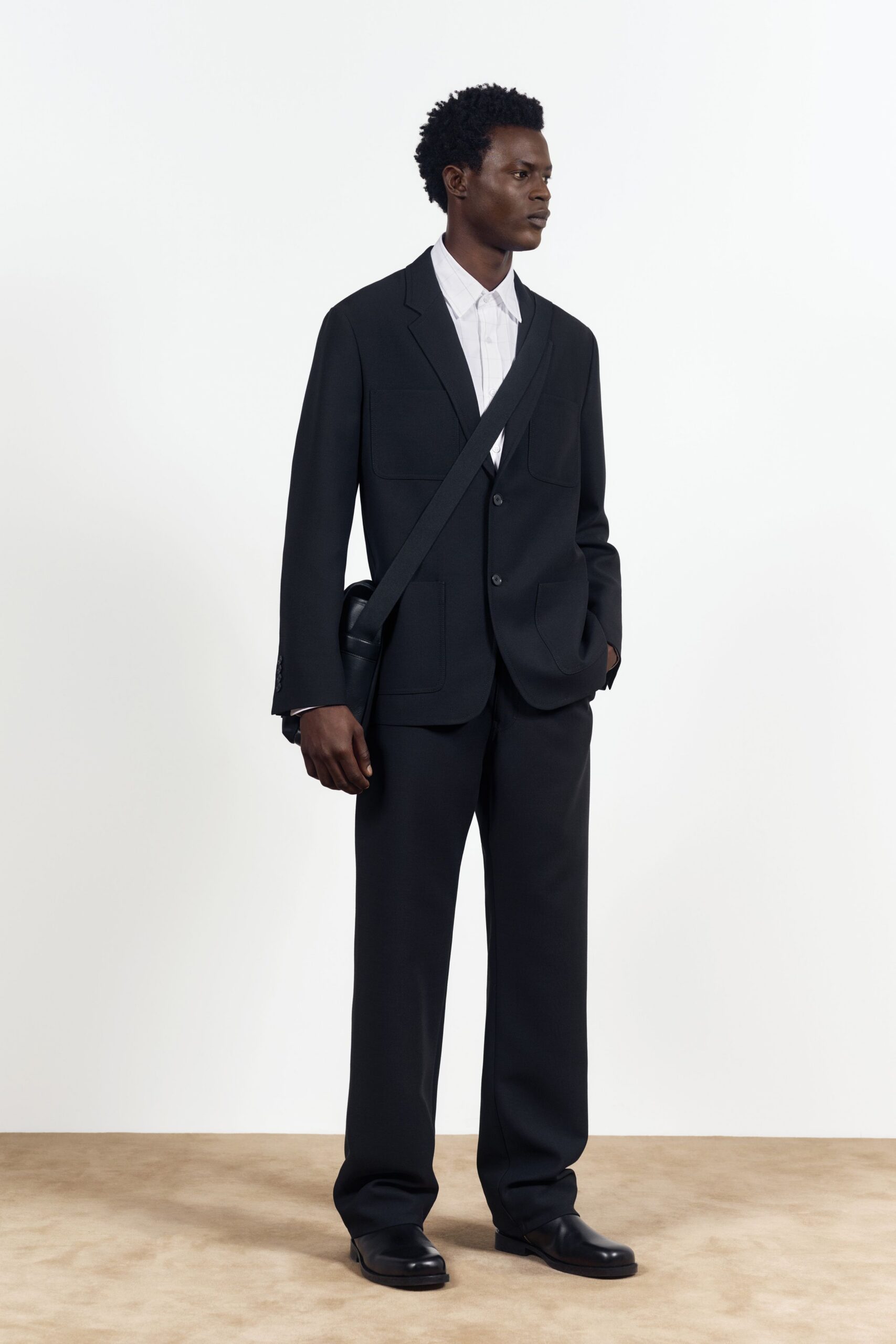 black tailored suit with white shirt
