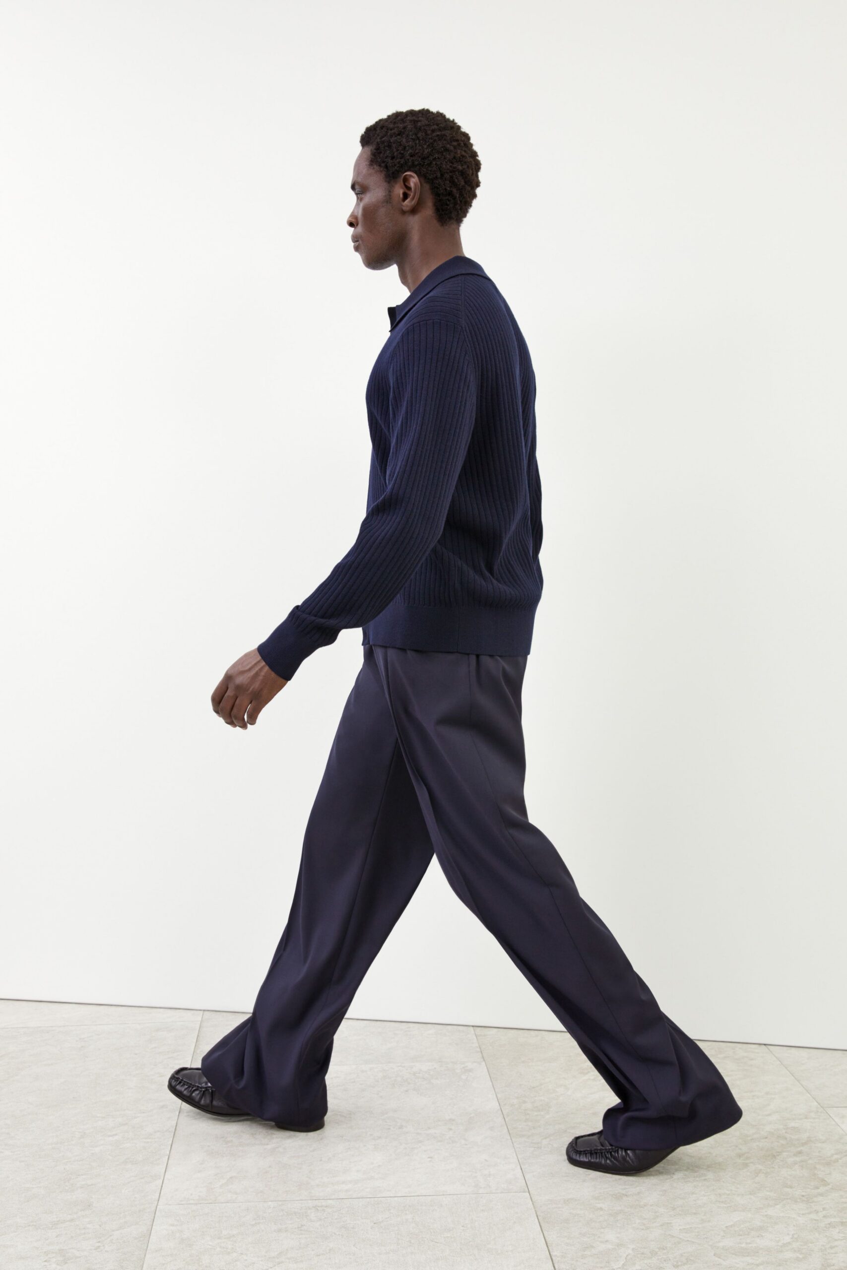 navy fitted sweater black pants