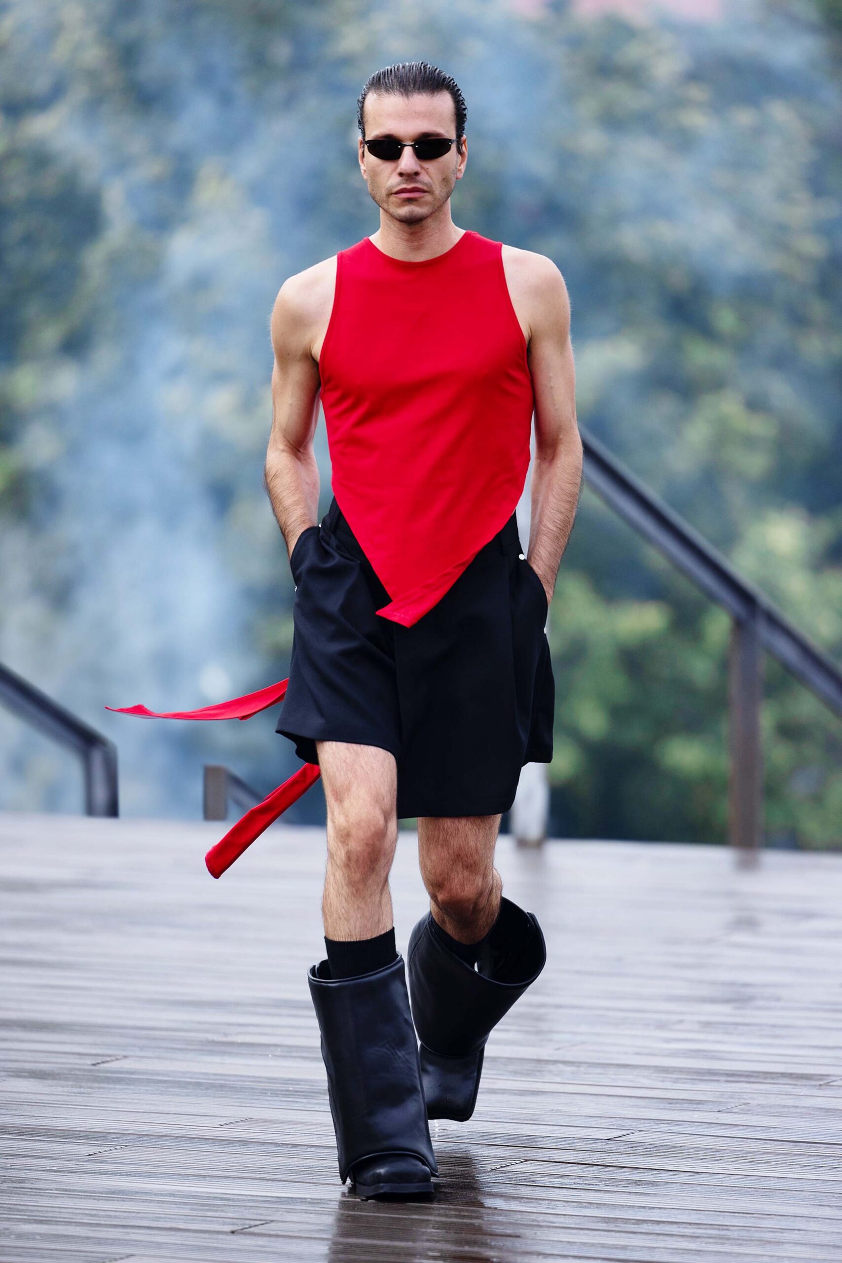 red fitted sleeveless top with black shorts