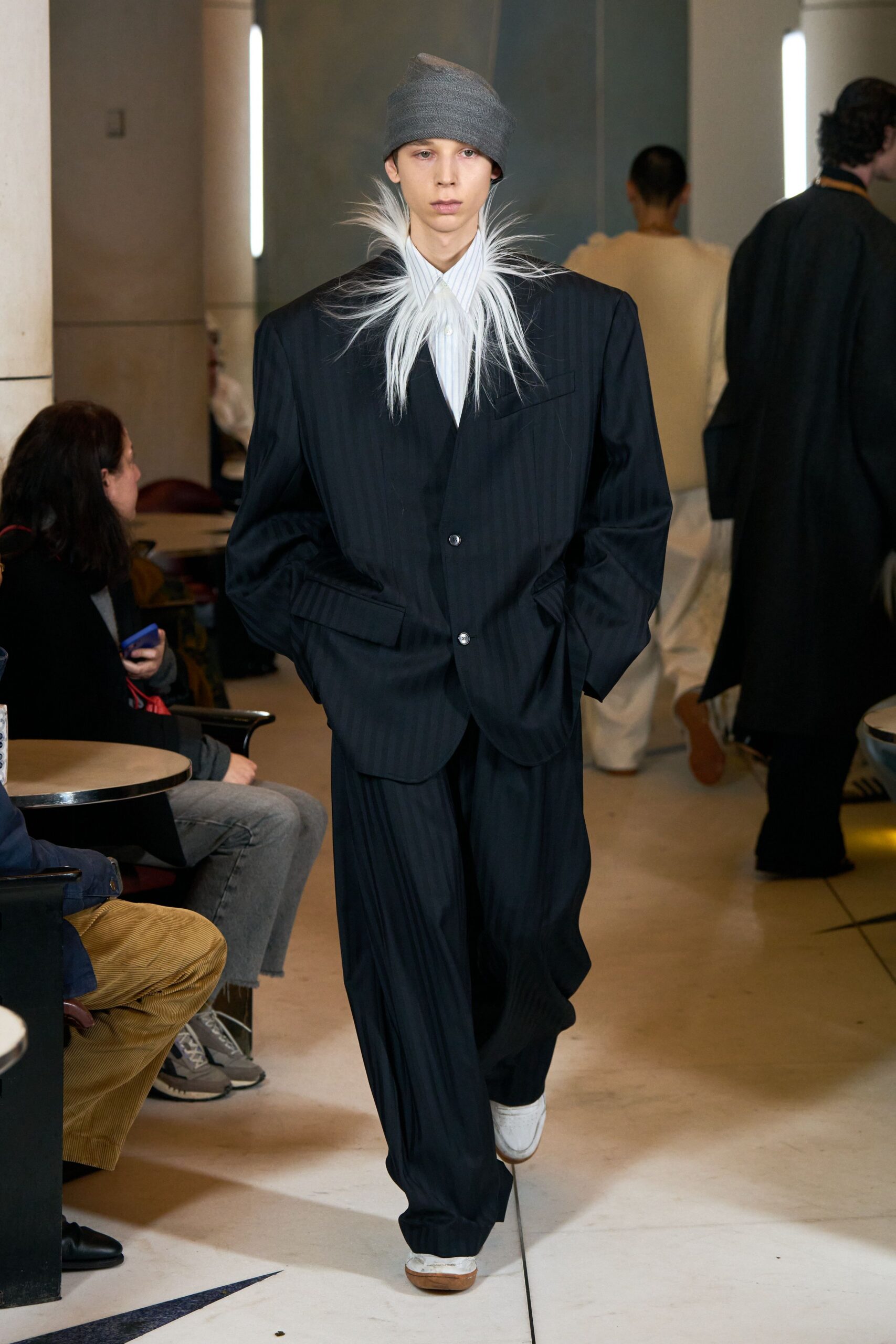 black tailored suit with gray hat