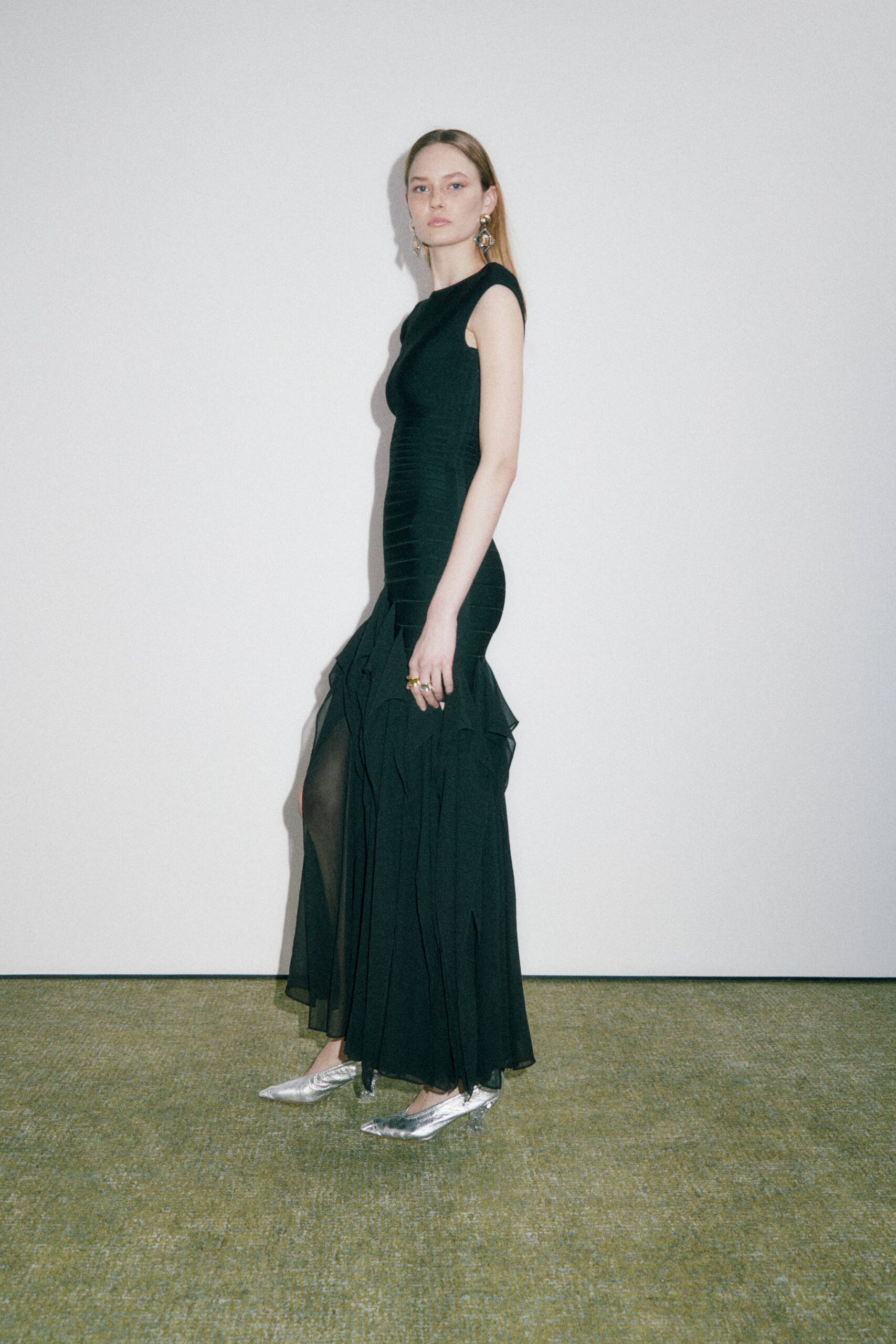 black silk sleeveless gown with ruffles
