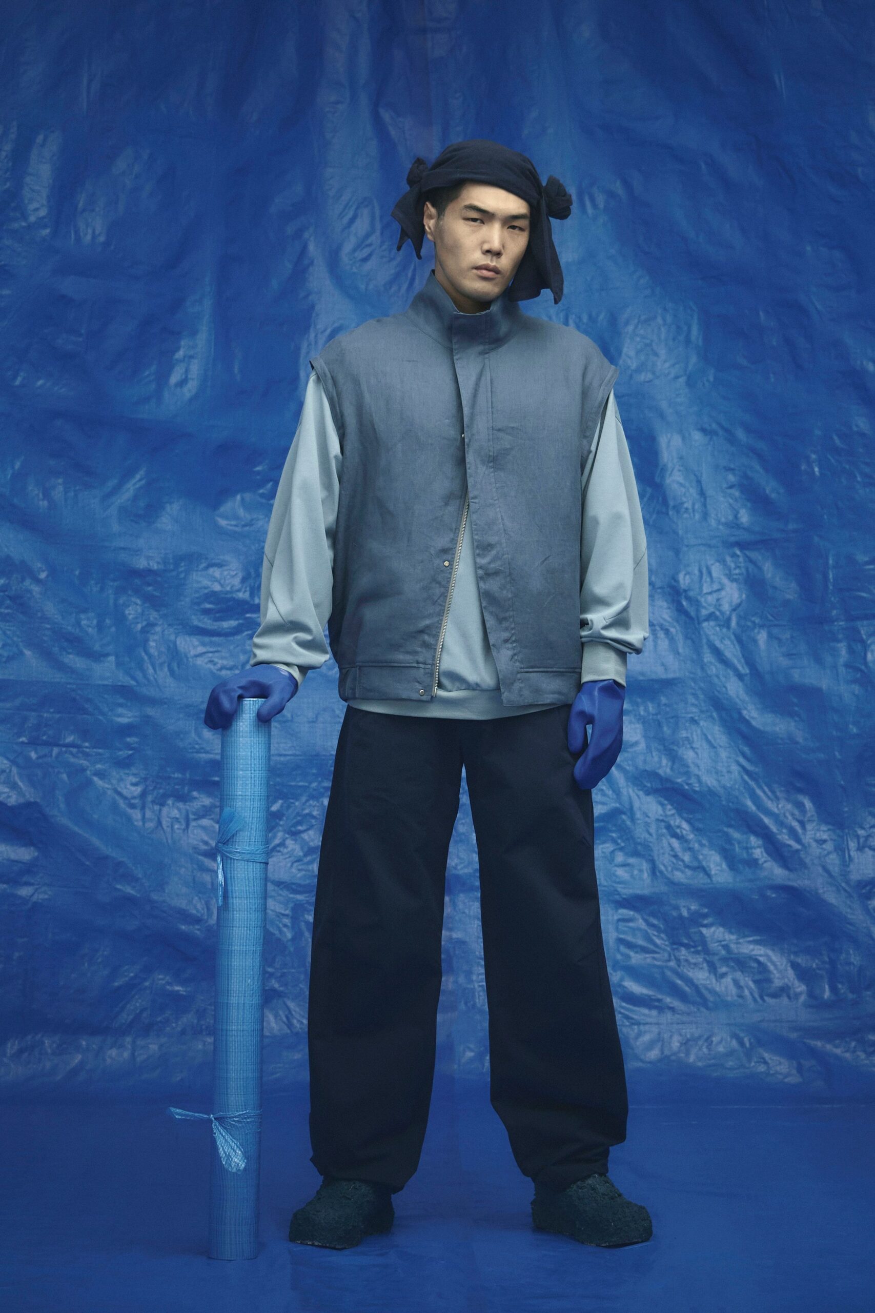 gray jacket blue shirt black pants