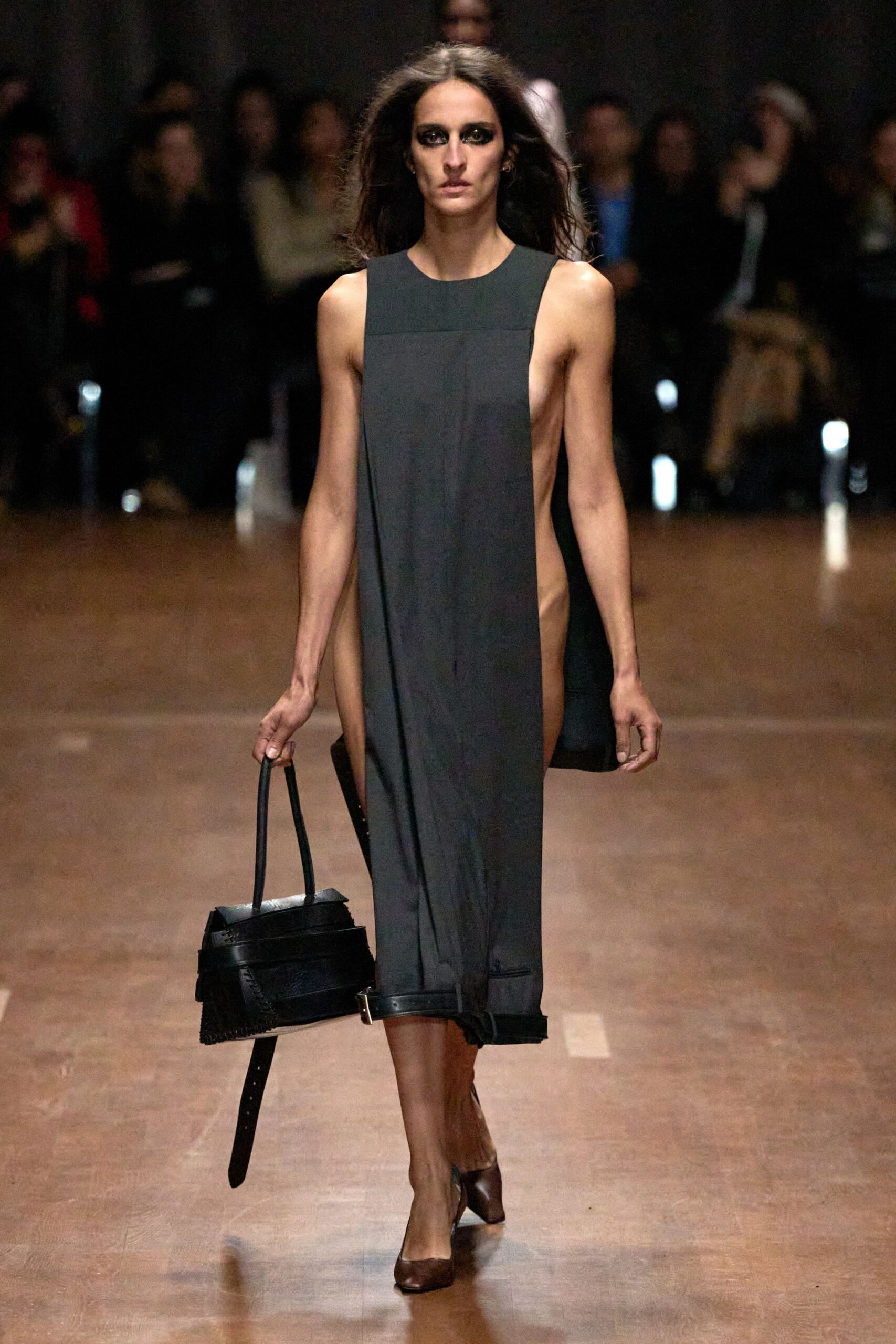 black asymmetric midi dress with leather bag