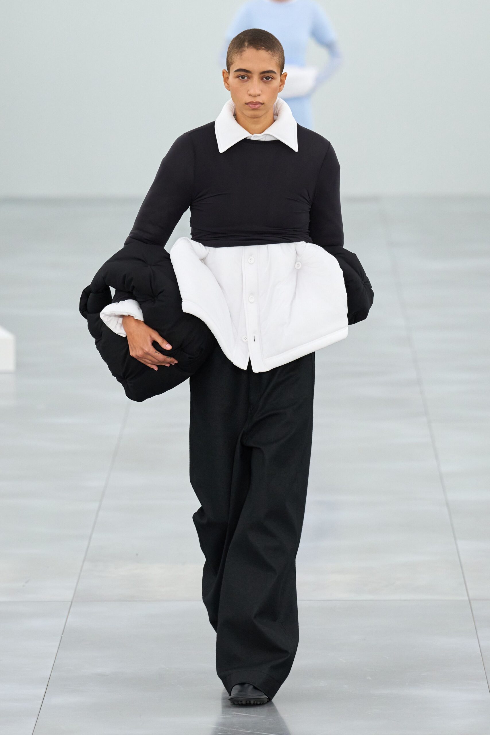 black fitted top with white jacket
