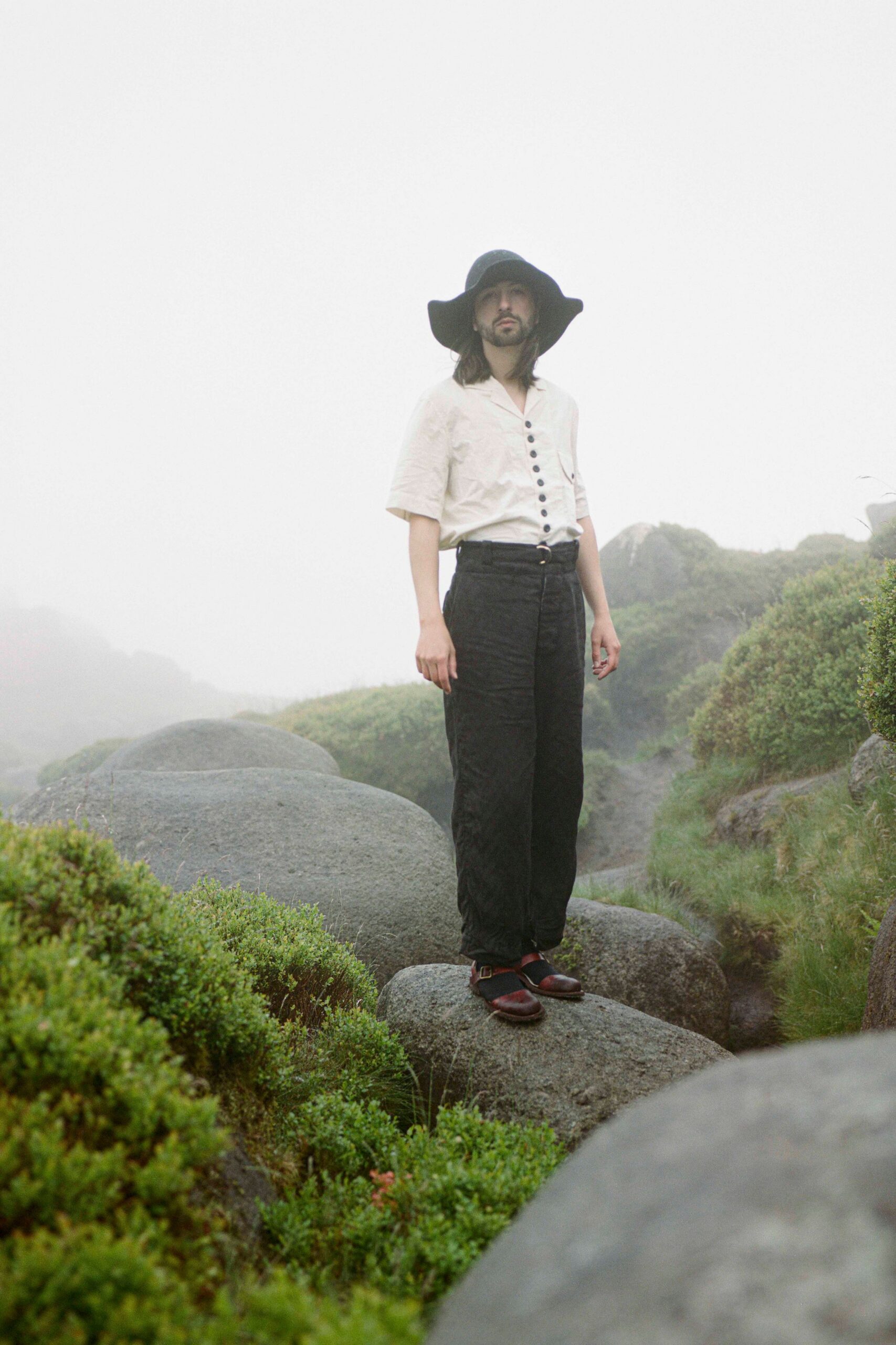 white shirt black pants black hat