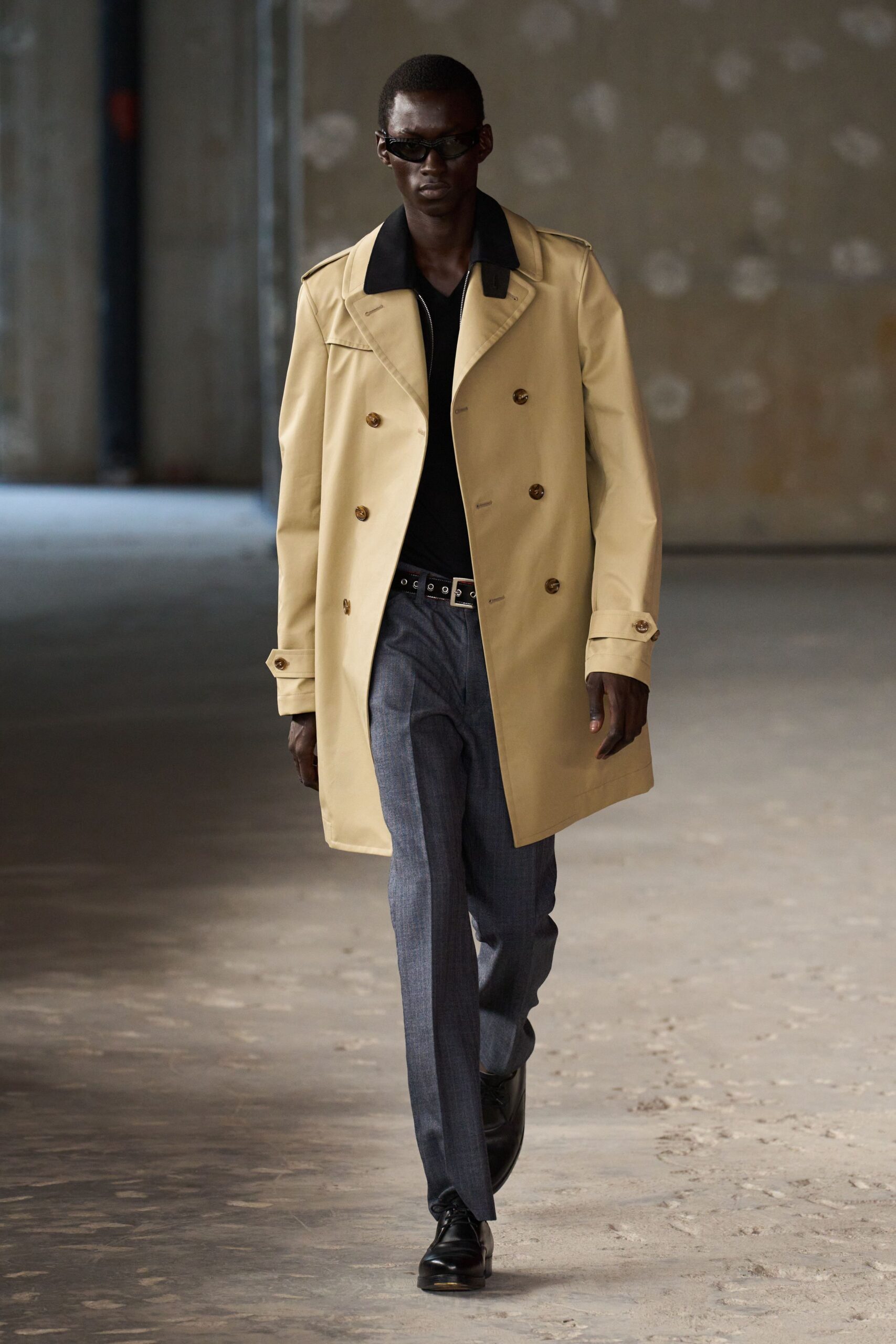 beige coat with black shirt and gray pants