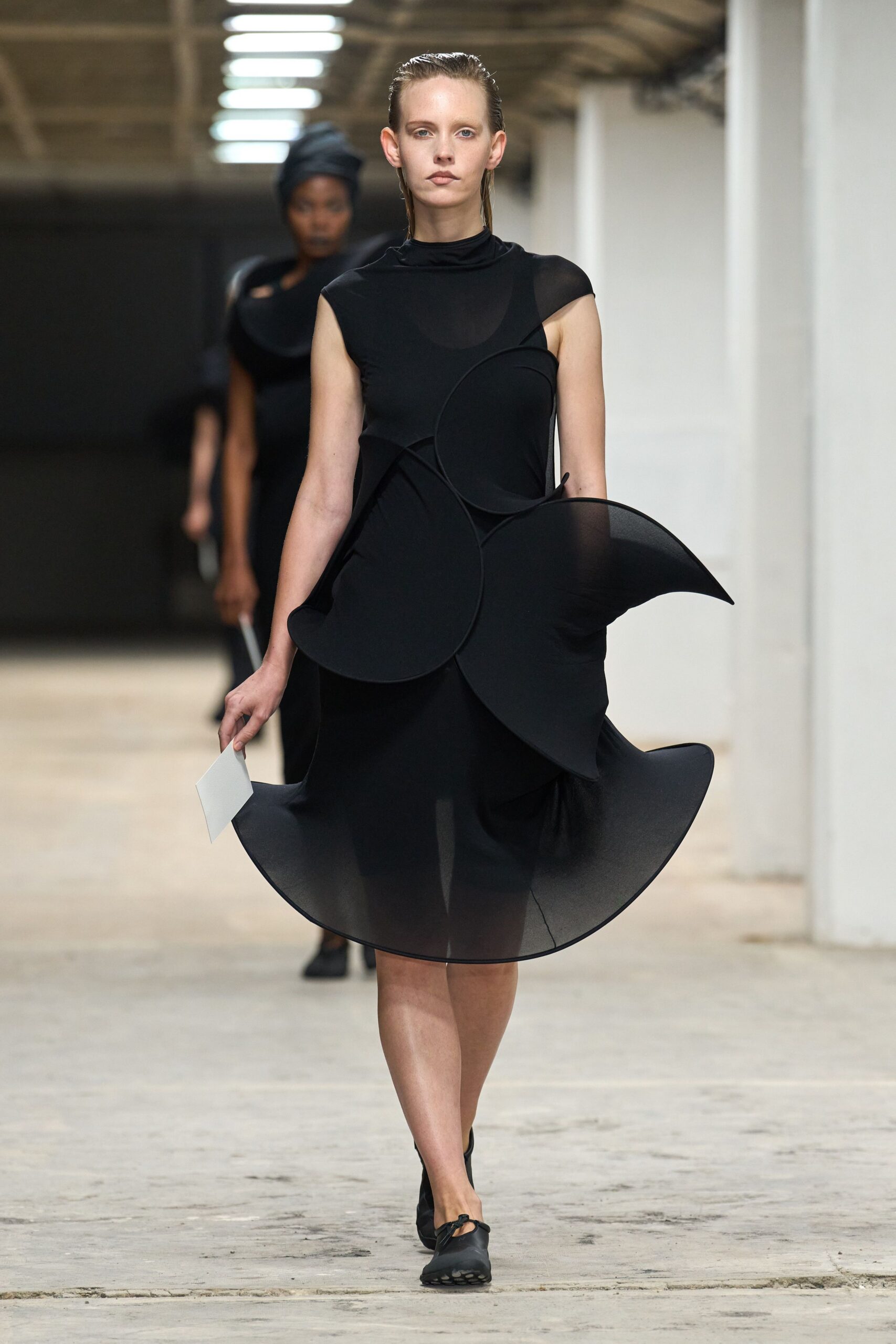 black silk sleeveless high-neck fitted draped flowing dress