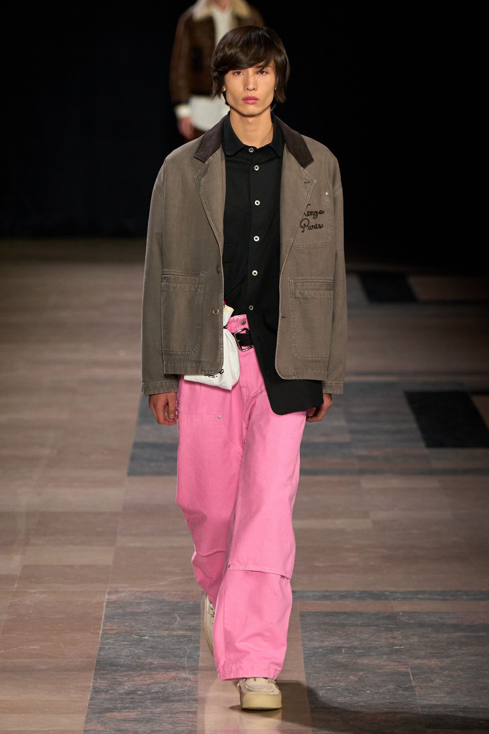 brown jacket black shirt pink pants
