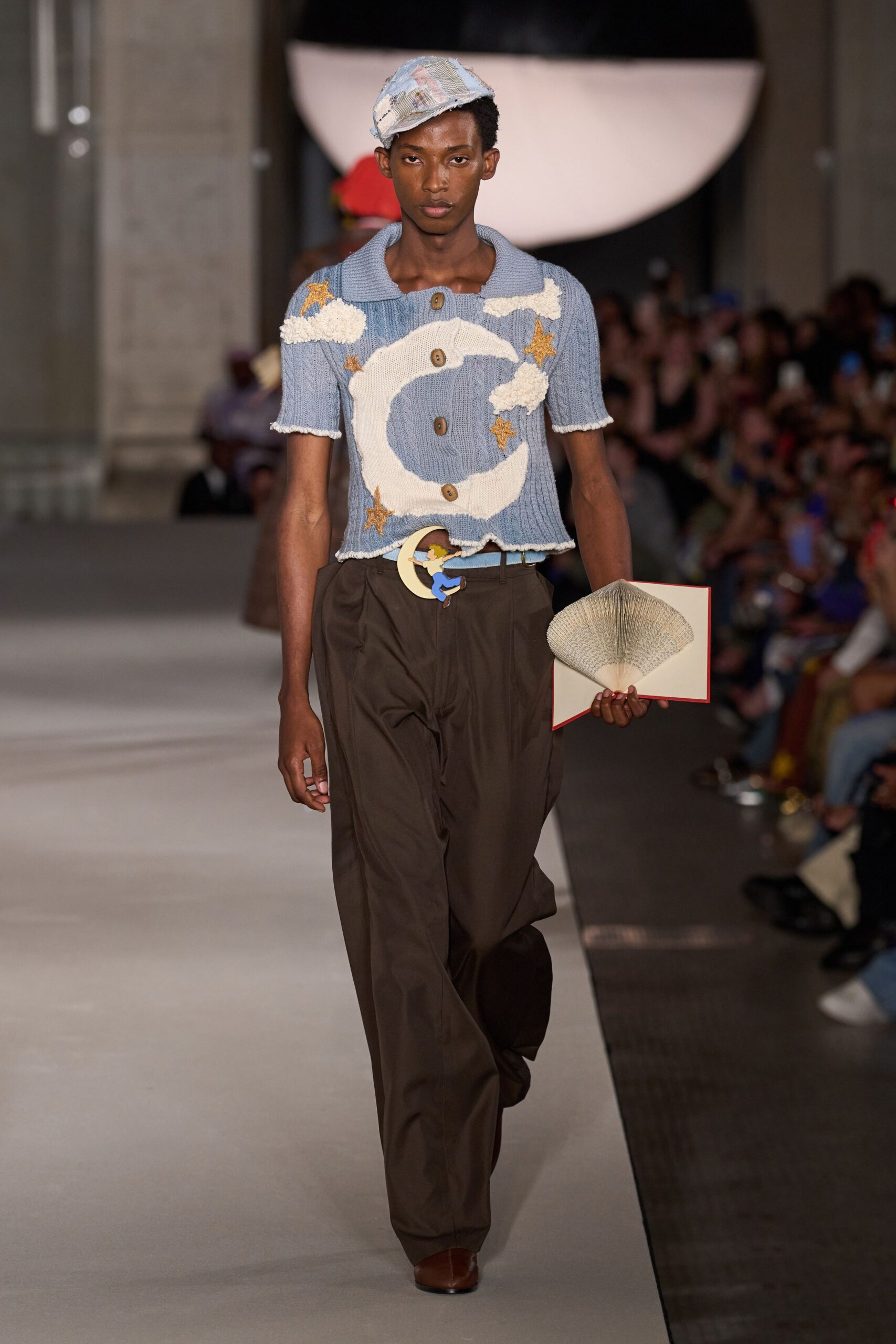 blue embroidered top and brown pants