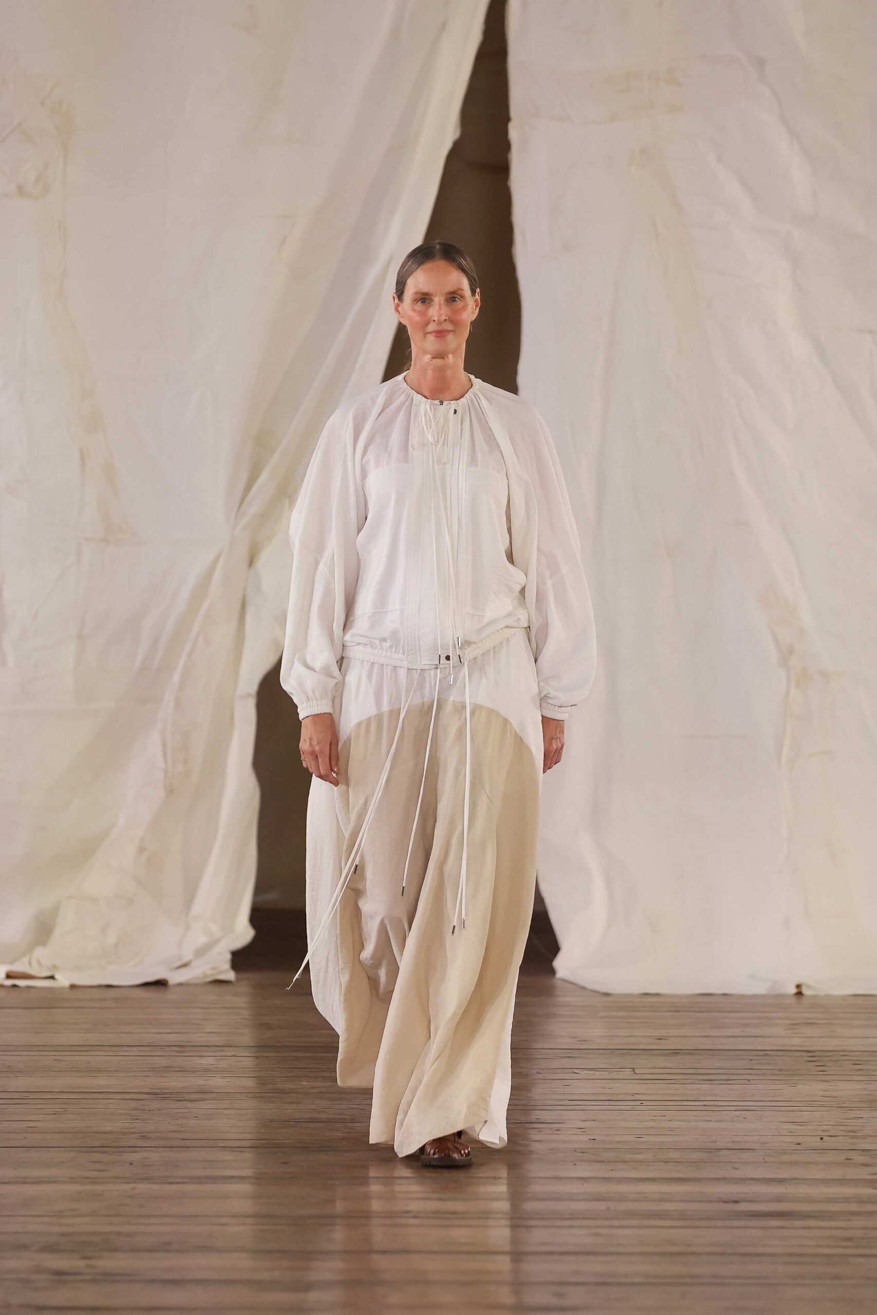 white relaxed top with beige maxi skirt
