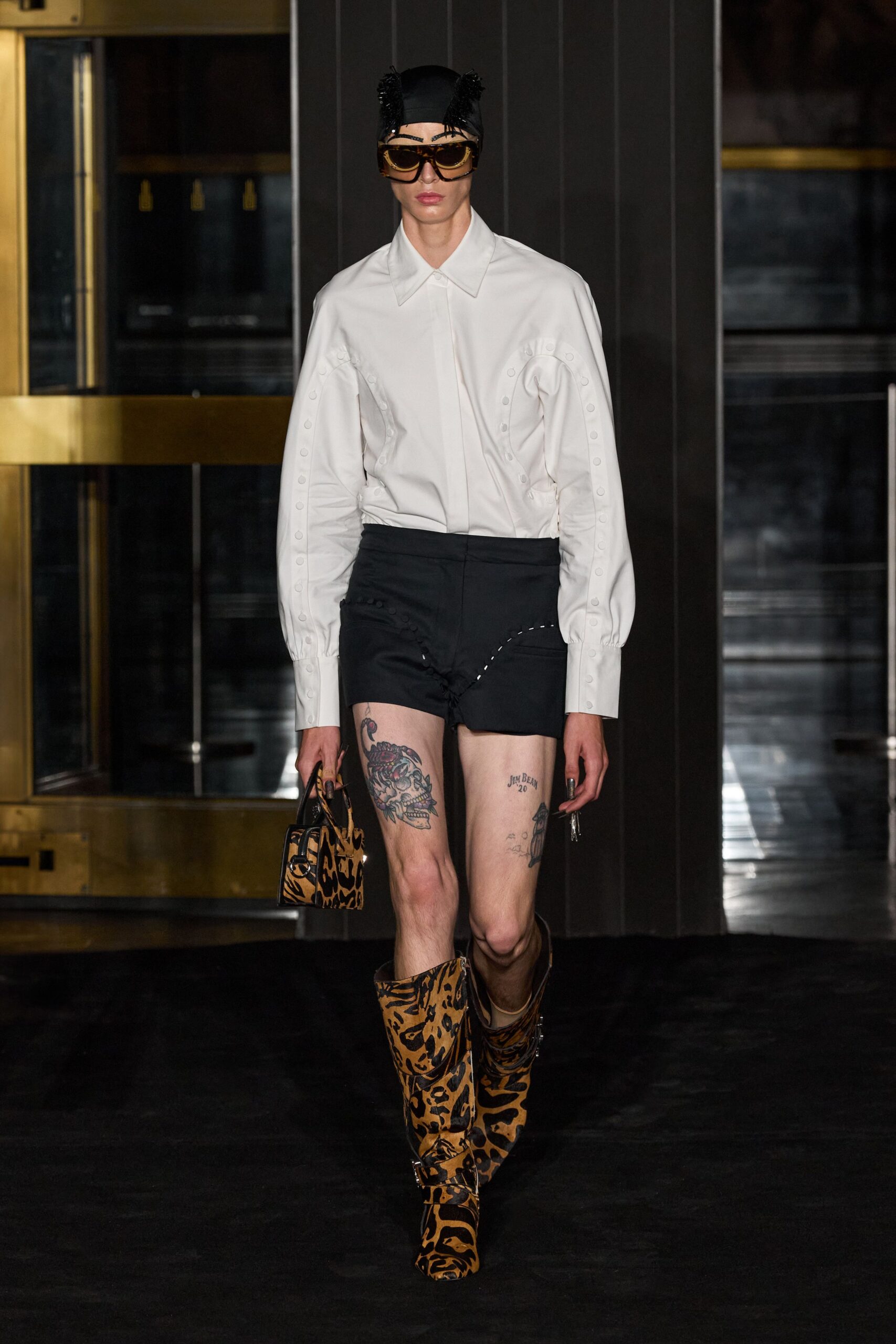 white fitted shirt with black shorts