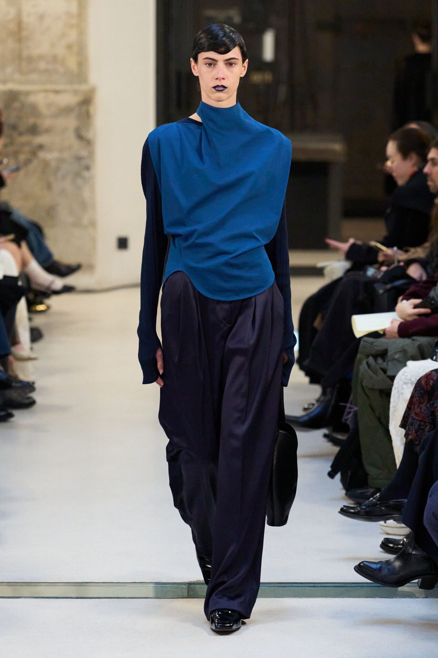blue relaxed top with black pants