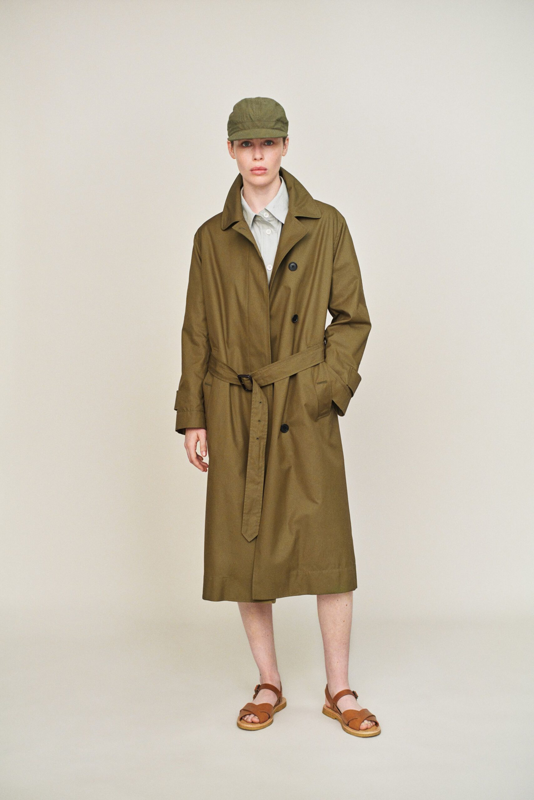 green trench coat with shirt and sandals
