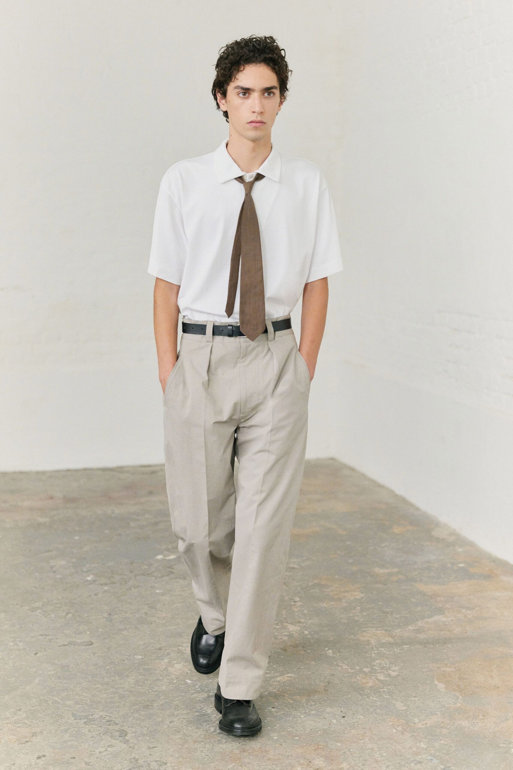 white relaxed shirt beige pants