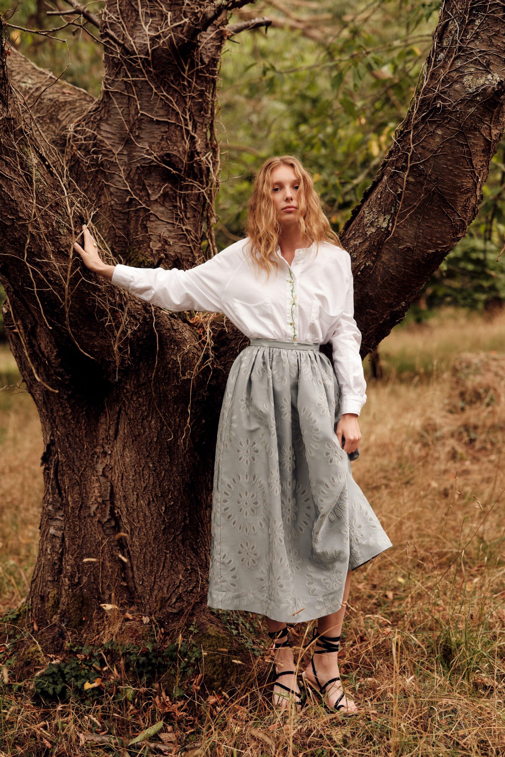 white shirt gray pleated skirt