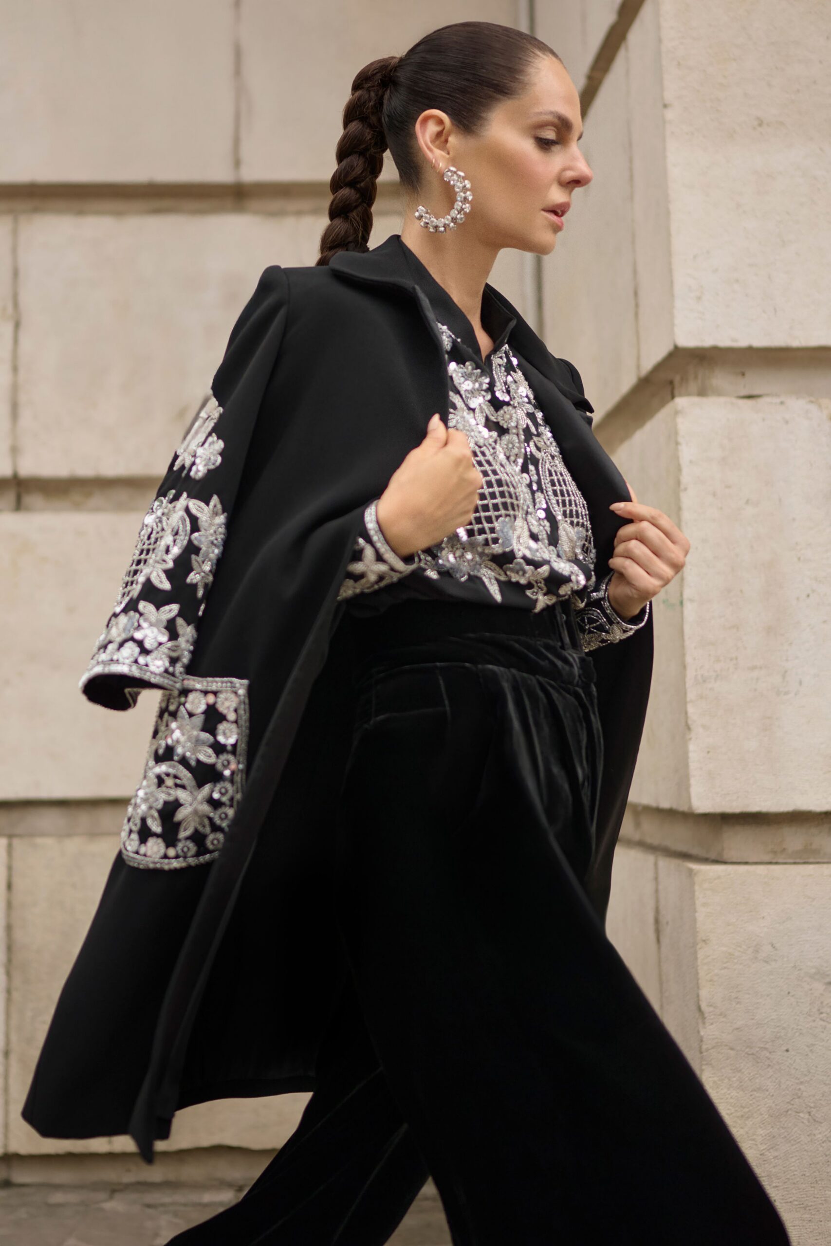 black wool coat with embroidered details